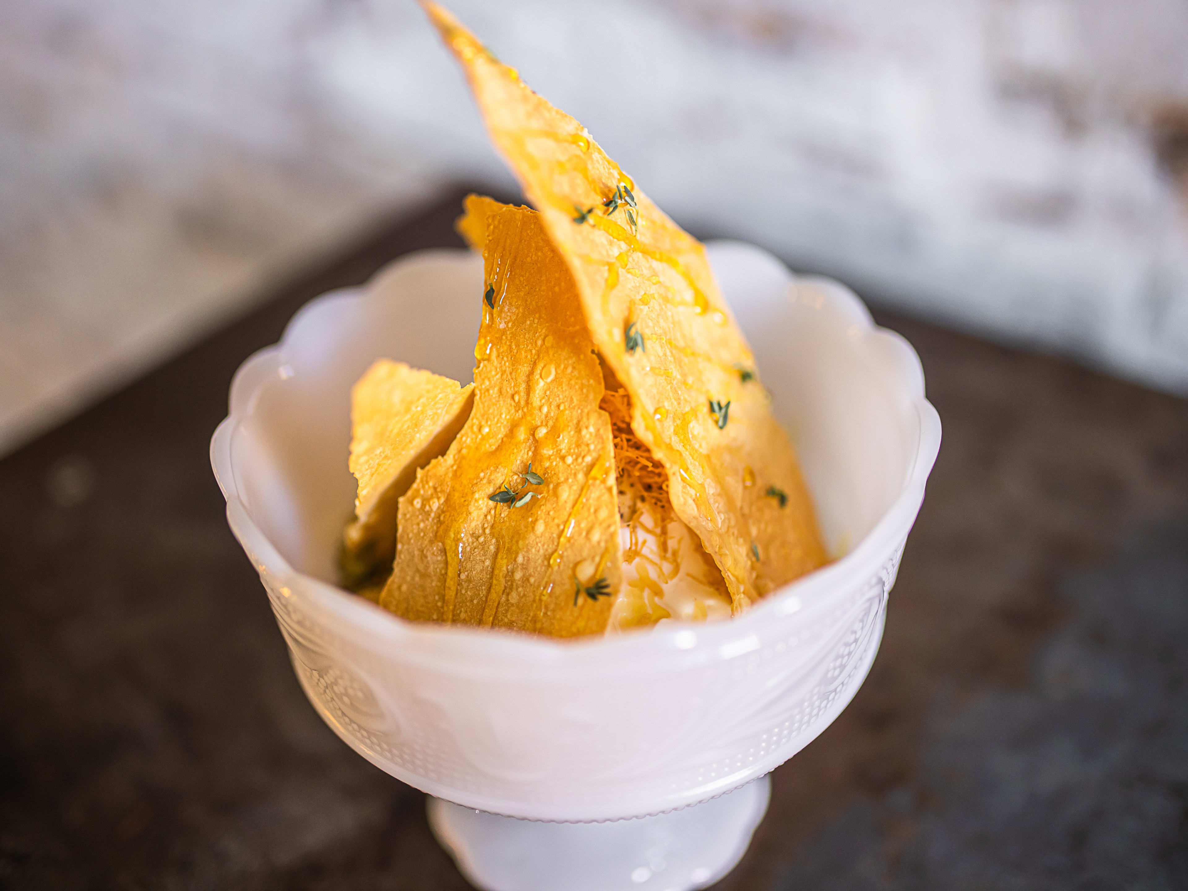 ice cream in dish with baklava shards on top