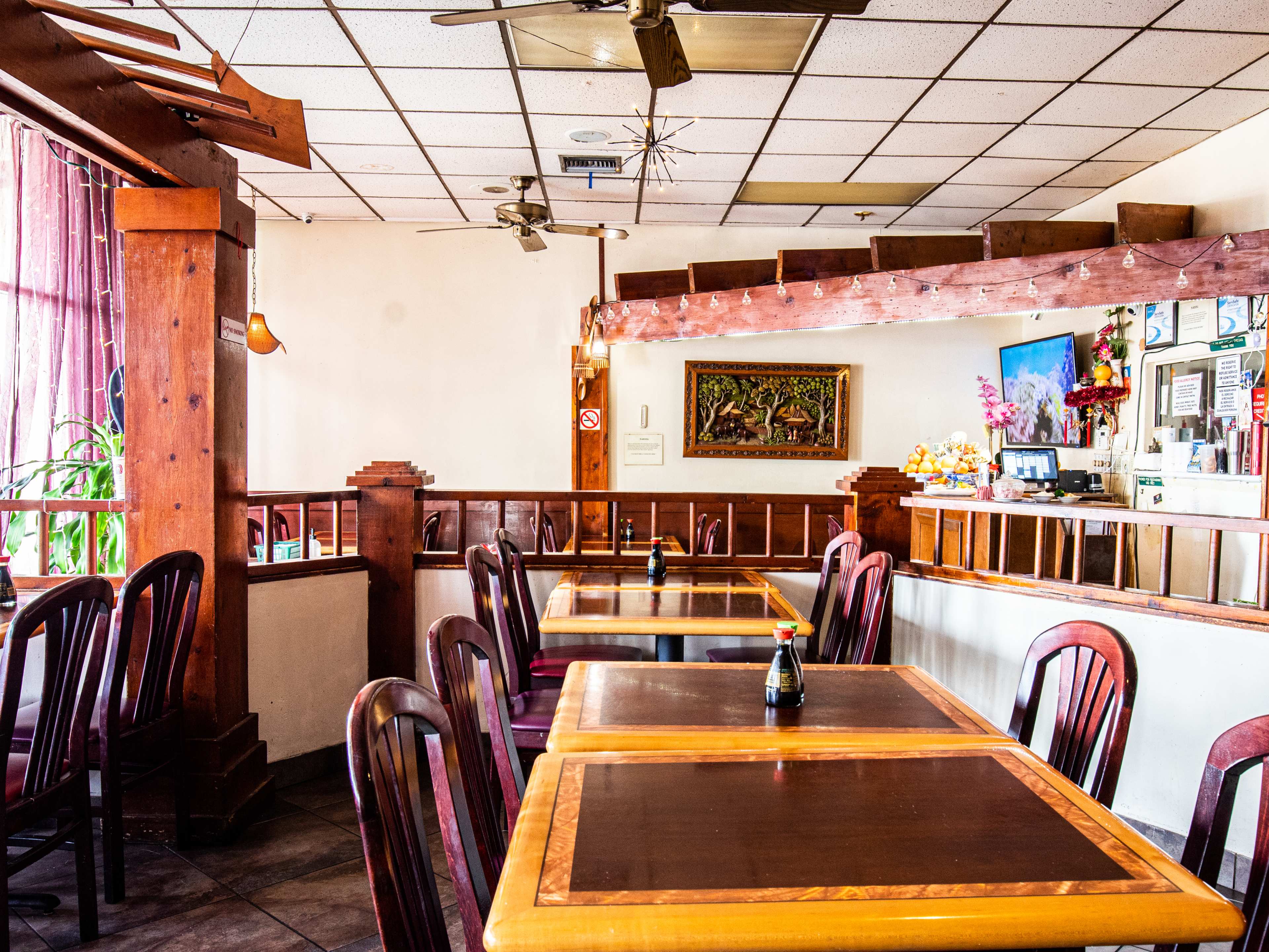 A dining room with wooden tables.