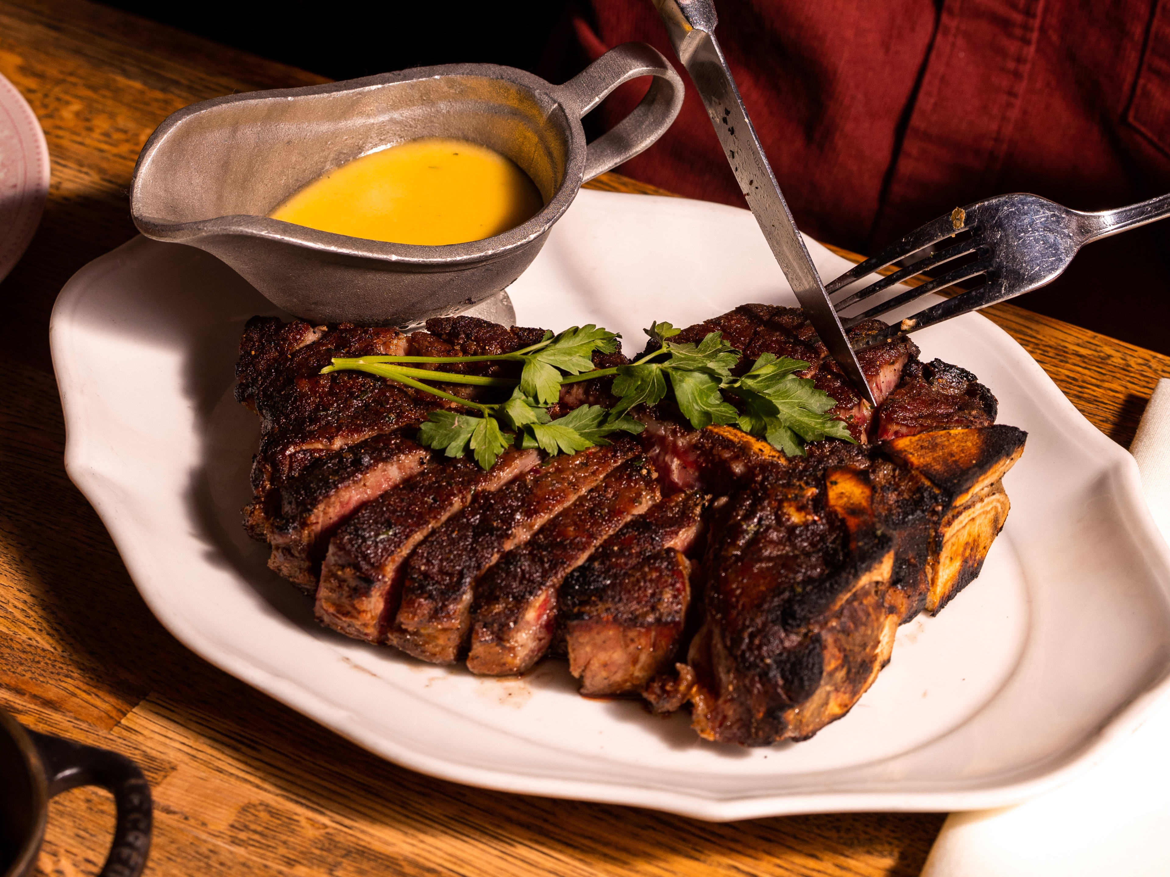 A steak from Bavette's with a side of sauce.