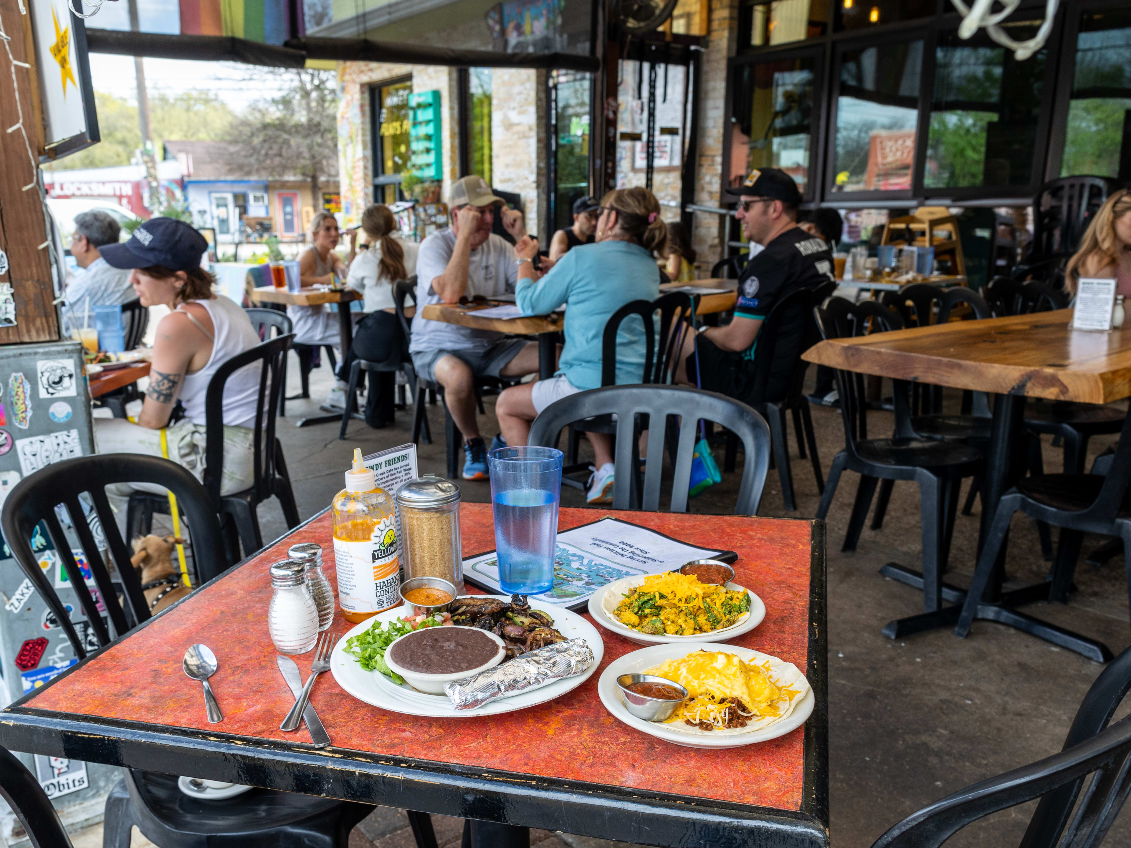 A spread of dishes on a table at the patio at Bouldin Creek Cafe.