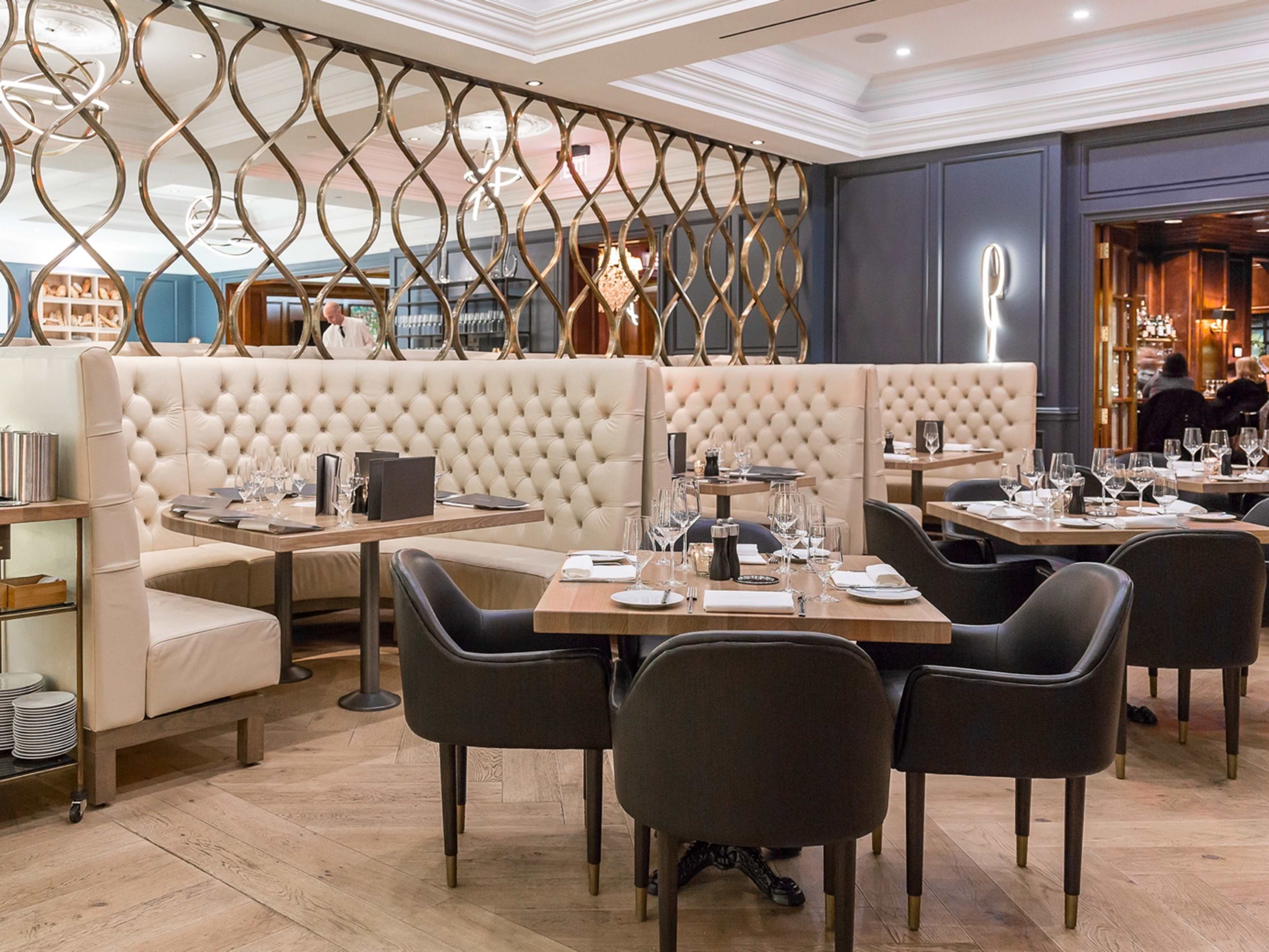 Tables and booths inside Boulevard Kitchen & Oyster Bar, a seafood restaurant in Vancouver