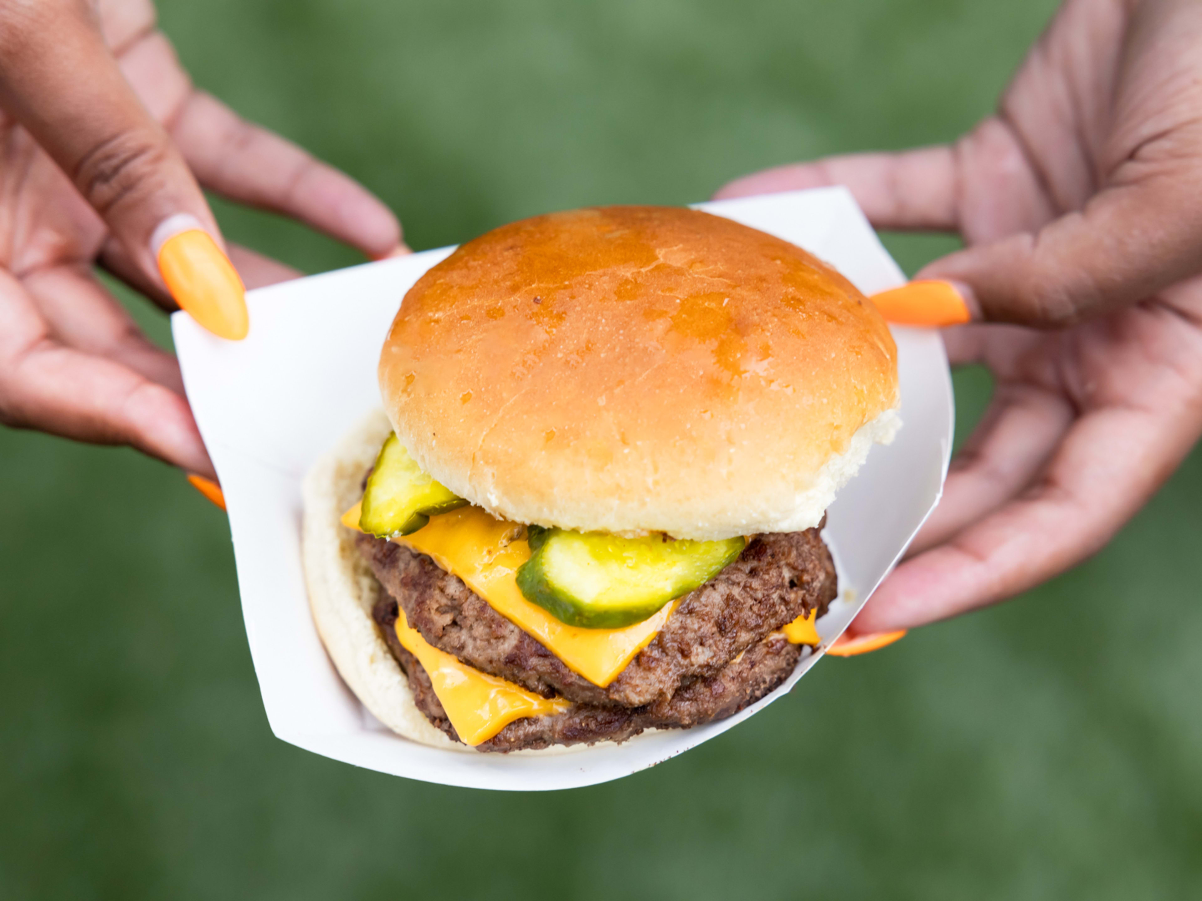 double patty burger with pickles and cheese