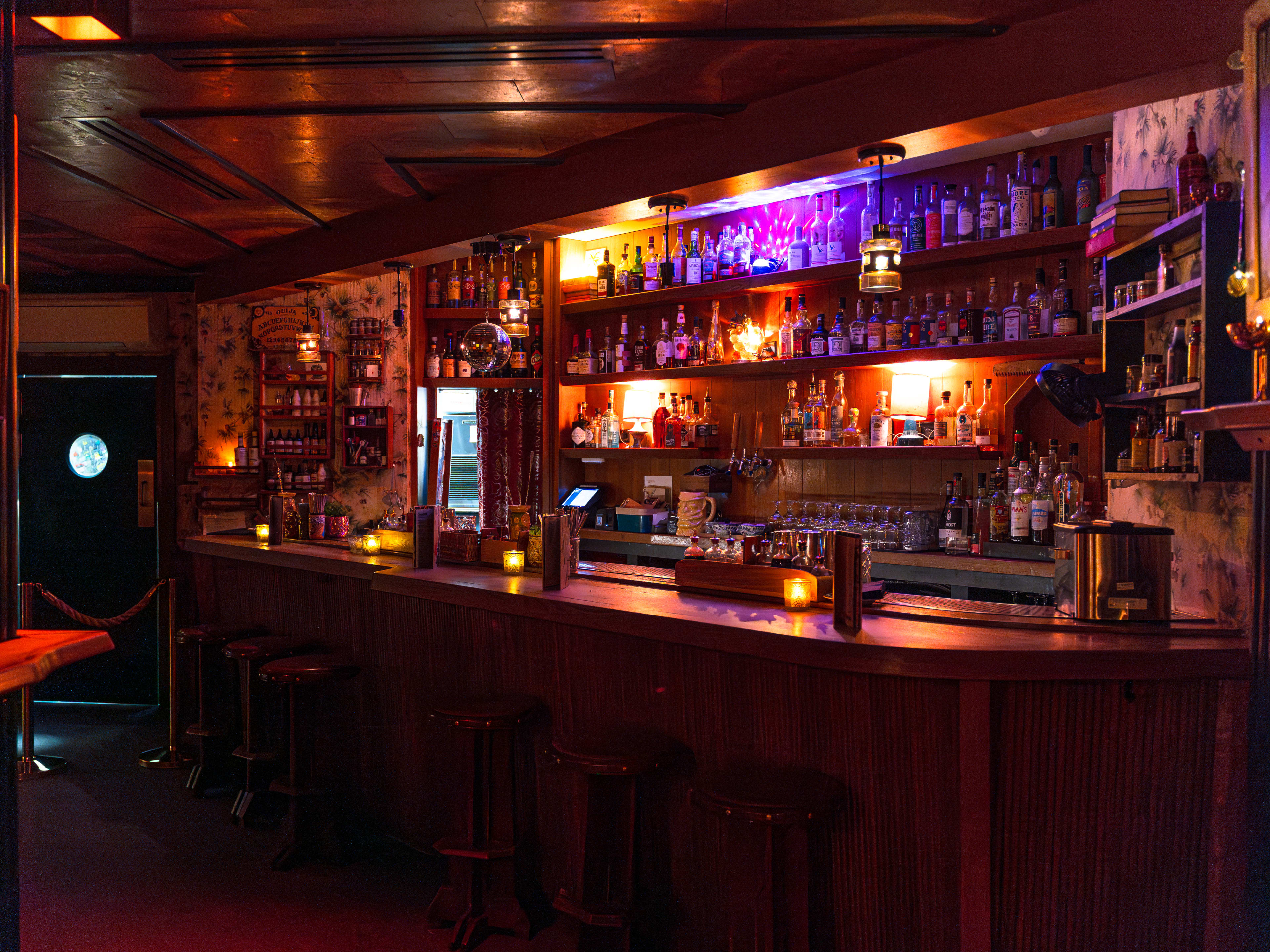 Broken Shaker tiki bar counter in dim lighting