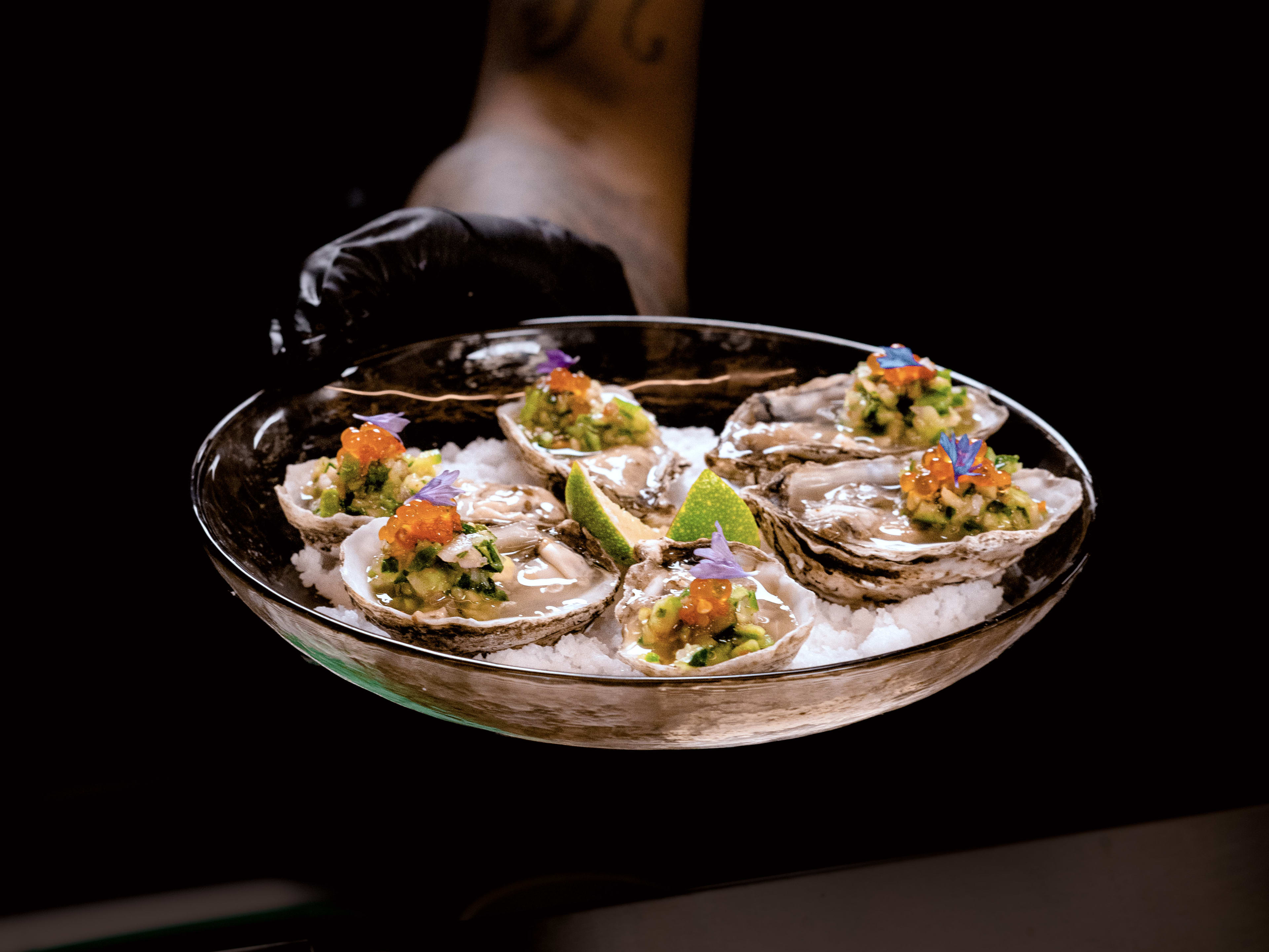 oysters with colorful toppings