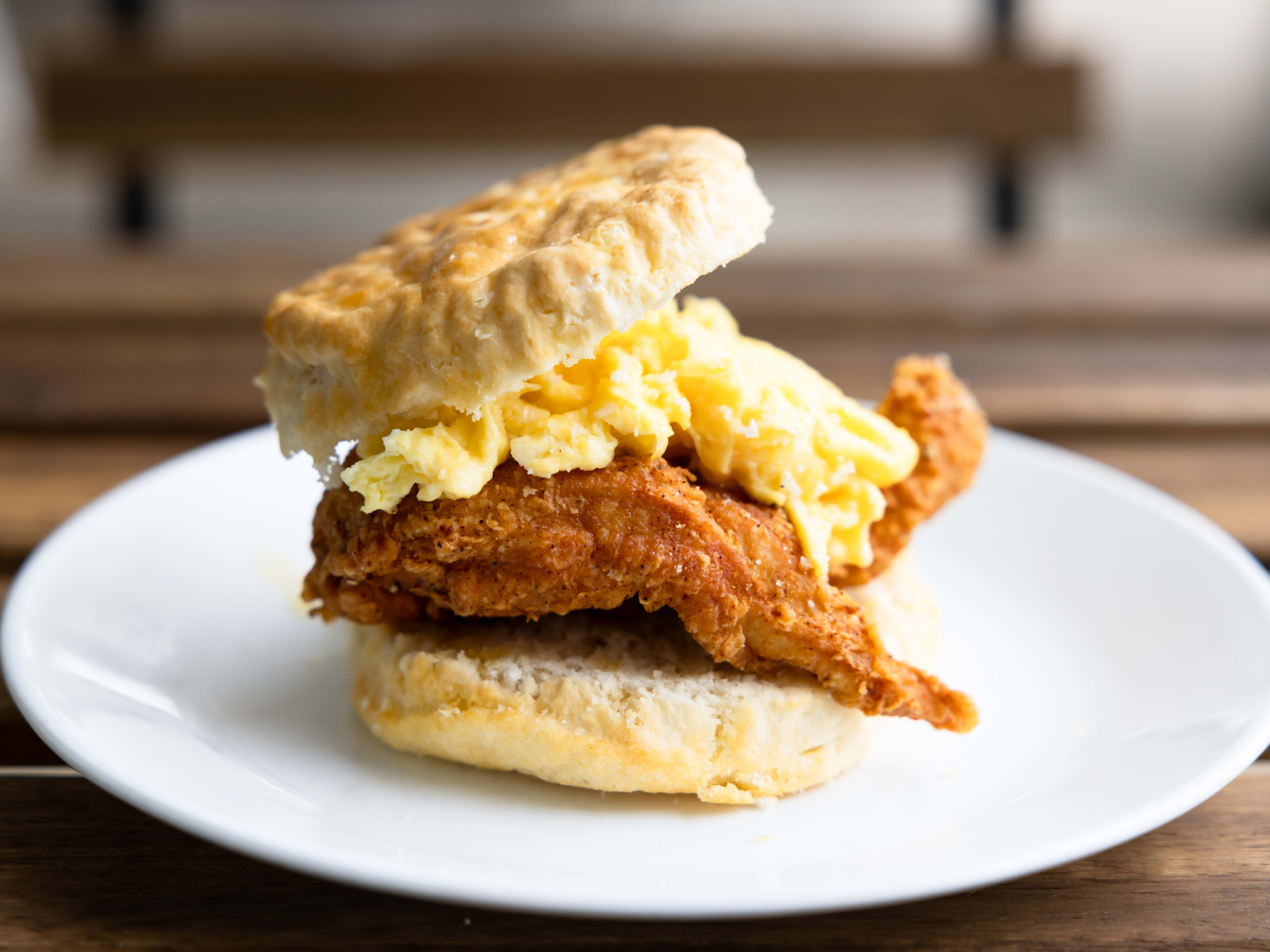 biscuit sandwich with fried chicken and scrambled egg