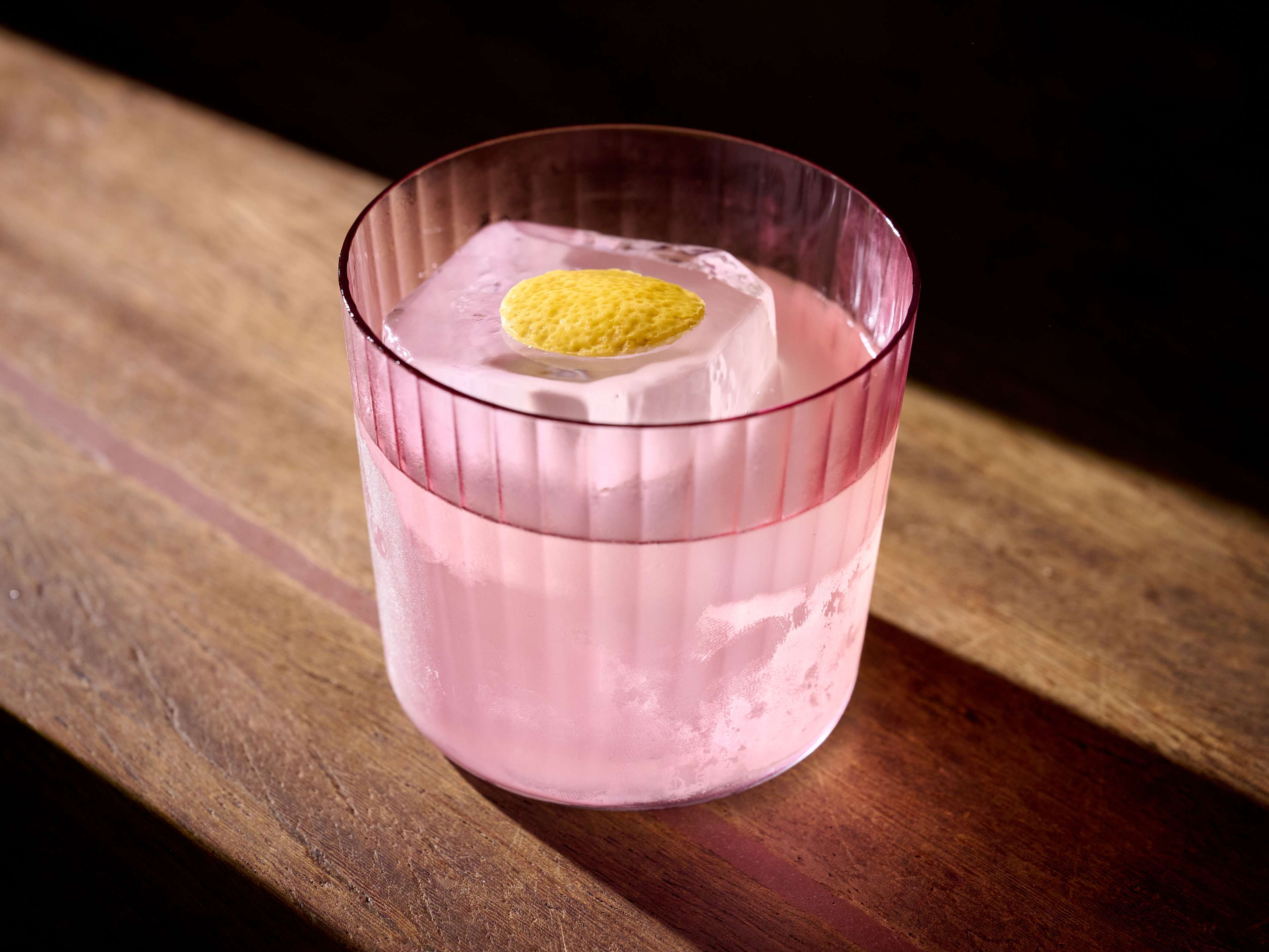 Cocktail in pink glass at Candelaria