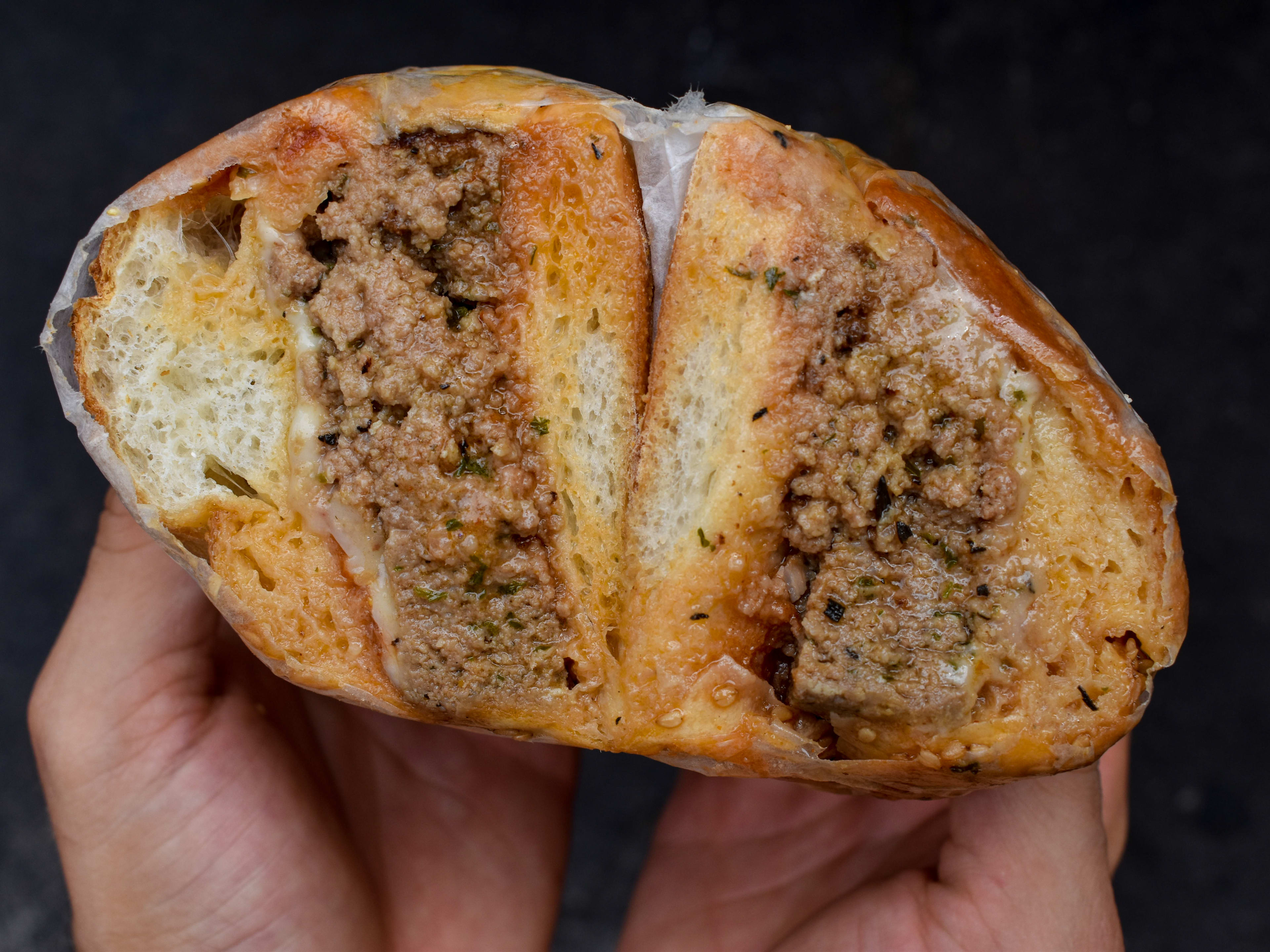 The meatloaf sandwich from Brancaccio's shown cut in half.