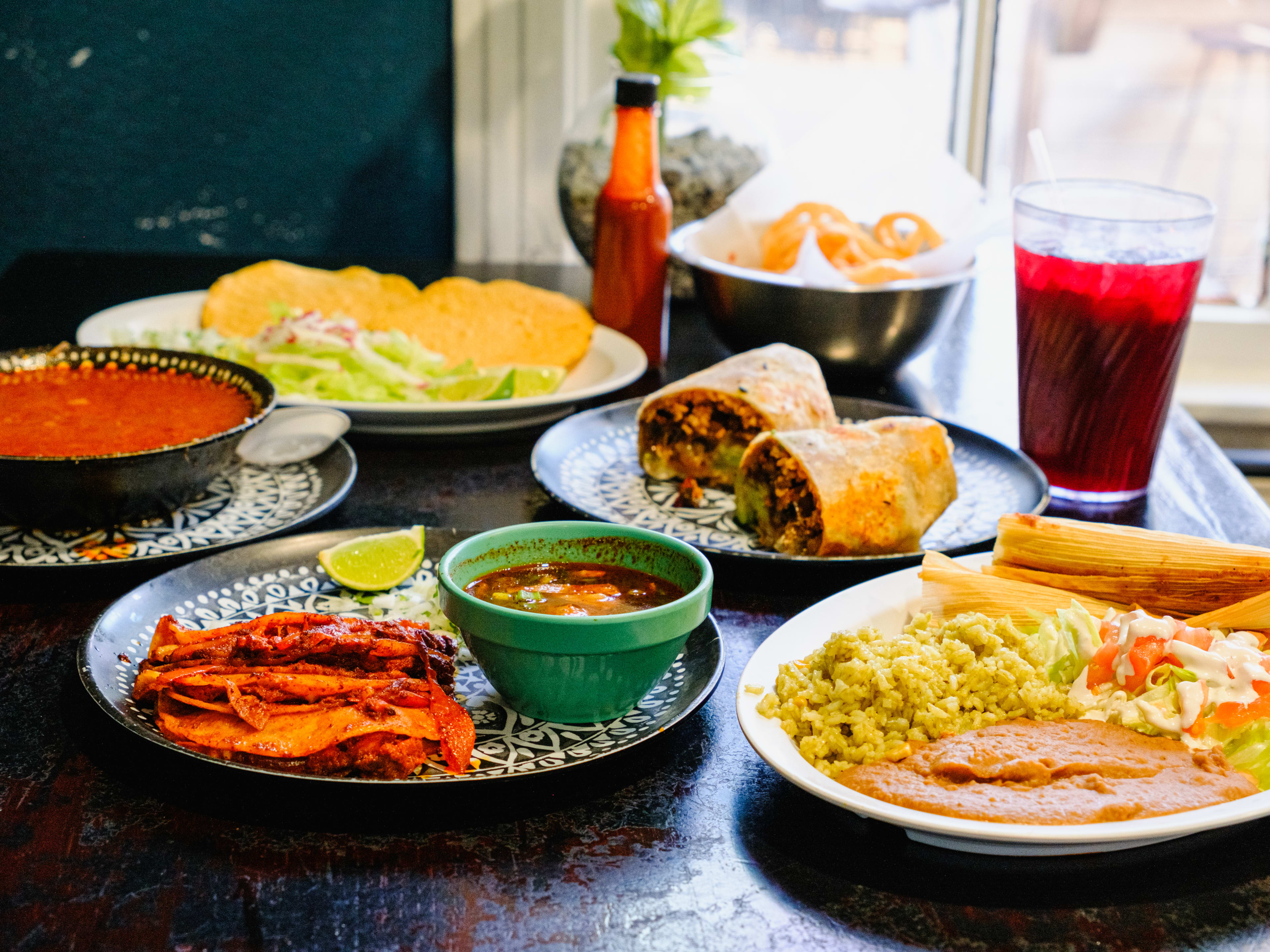 posole, tamales, birria tacos, and hibiscus agua fresca