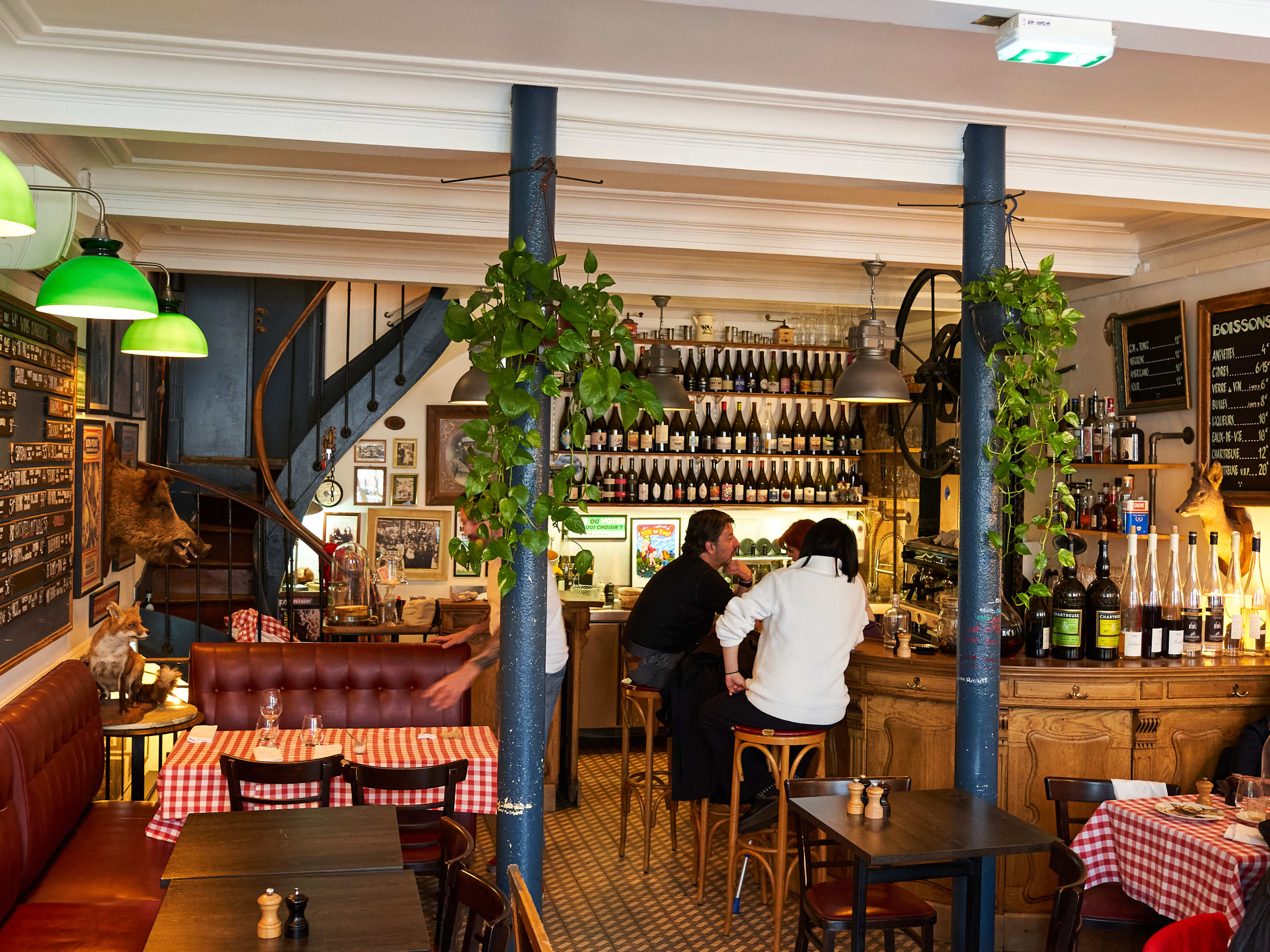 Interior bar spacee with spiral staircase leading up at Chez Marius