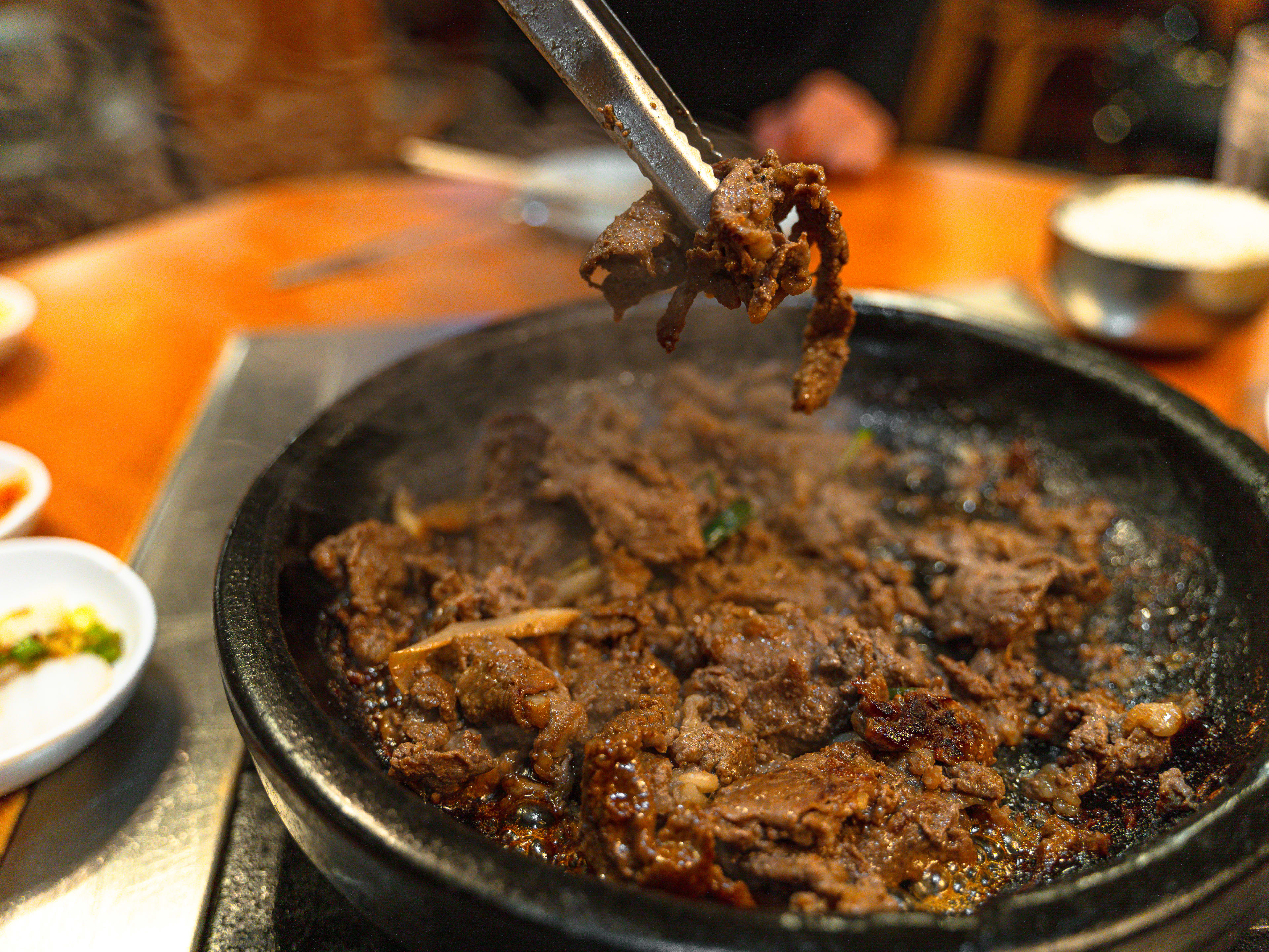 Bulgogi grilling in a stone plate.