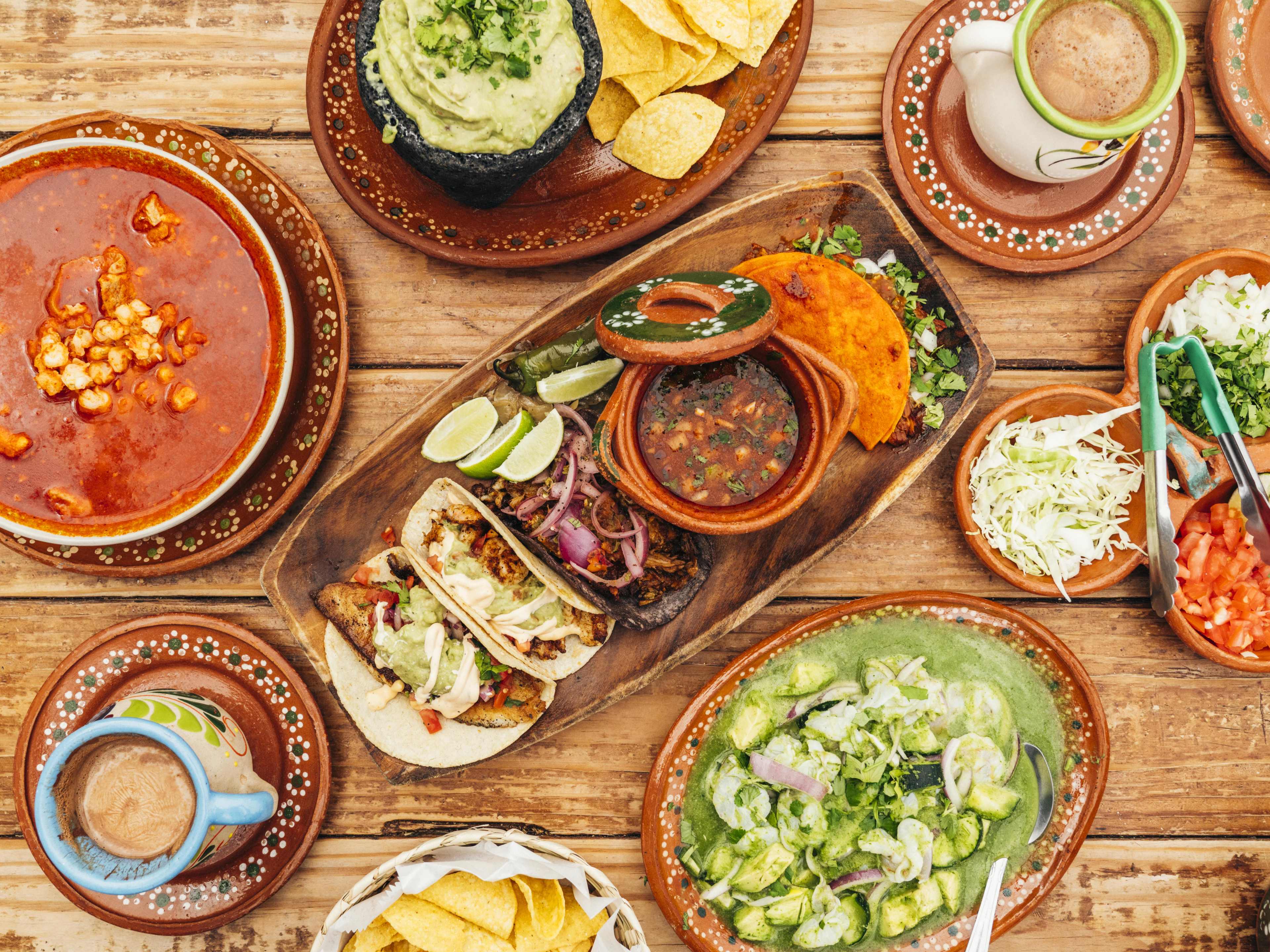 A spread of aguachile, tacos, and pozole at Chuy's Fiestas