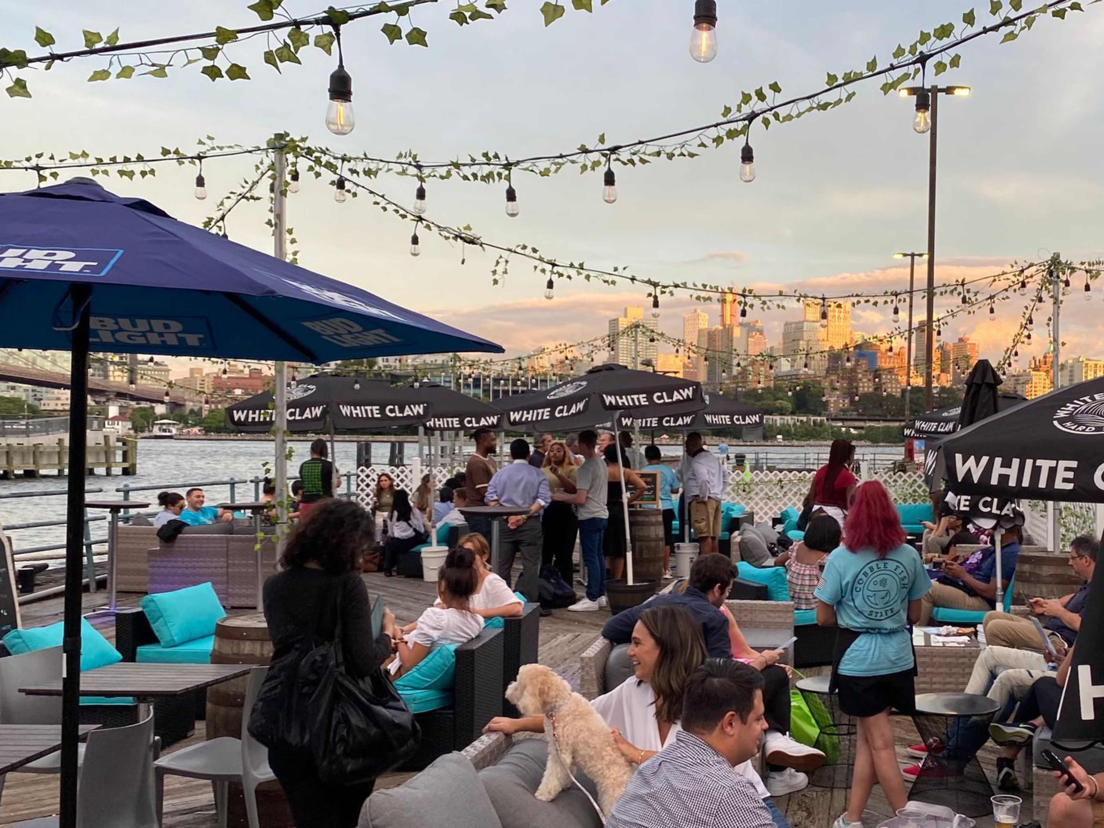 Customers and staff among the outdoor seating at Cobble Fish.