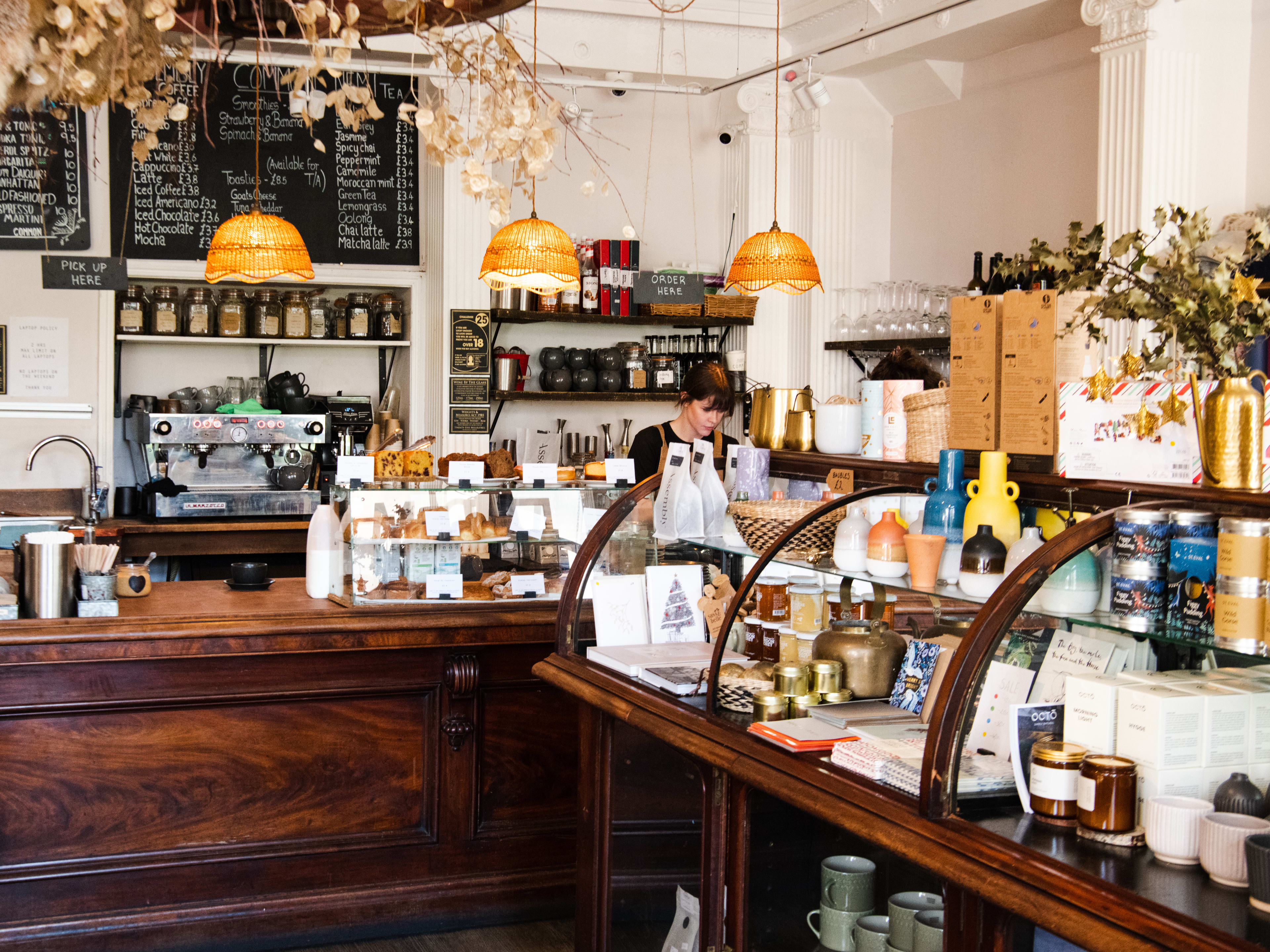 The coffee counter at Common. There are also items available for purchase including coffee accessories and candles.