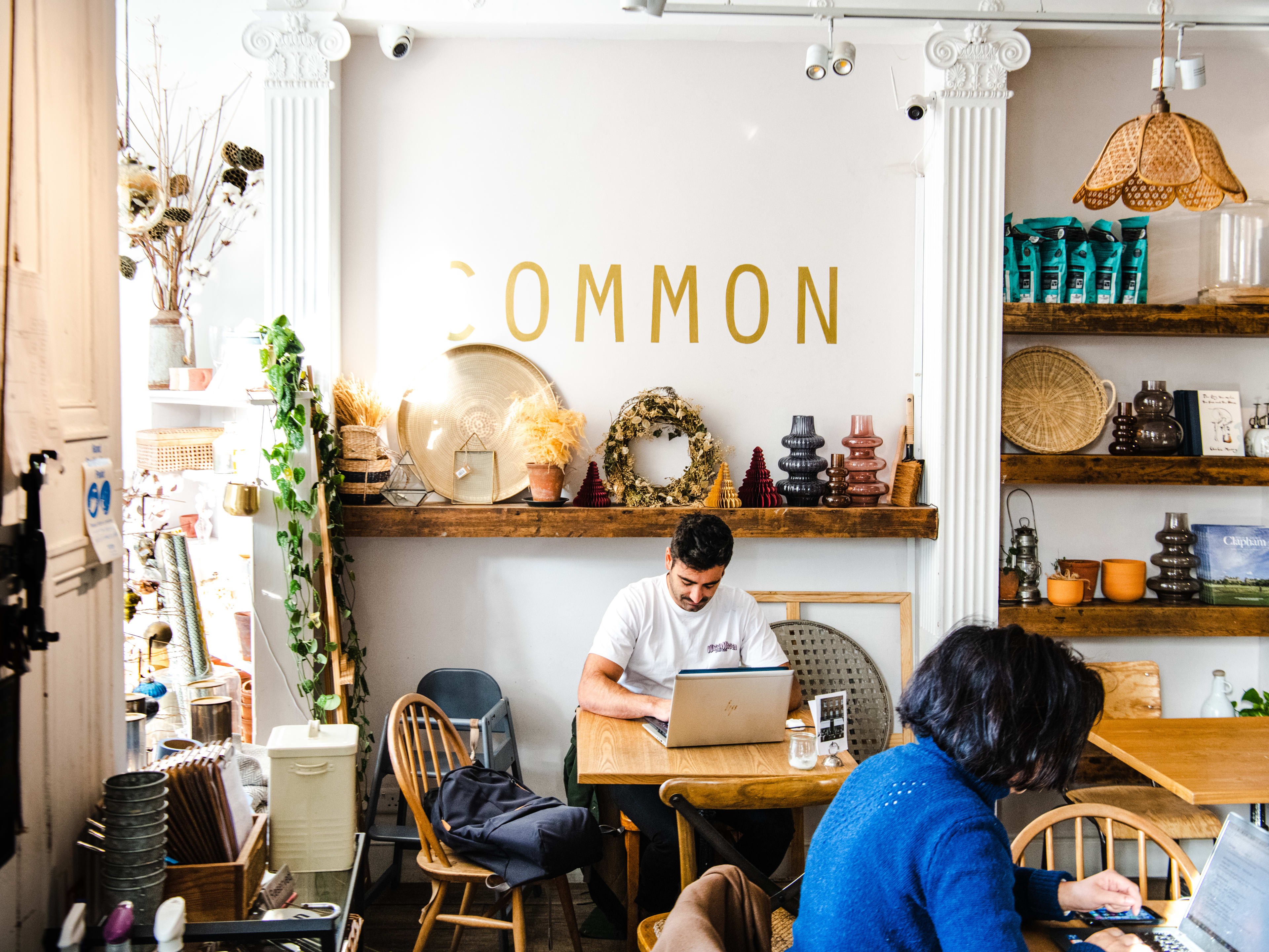 People working at tables at Common.