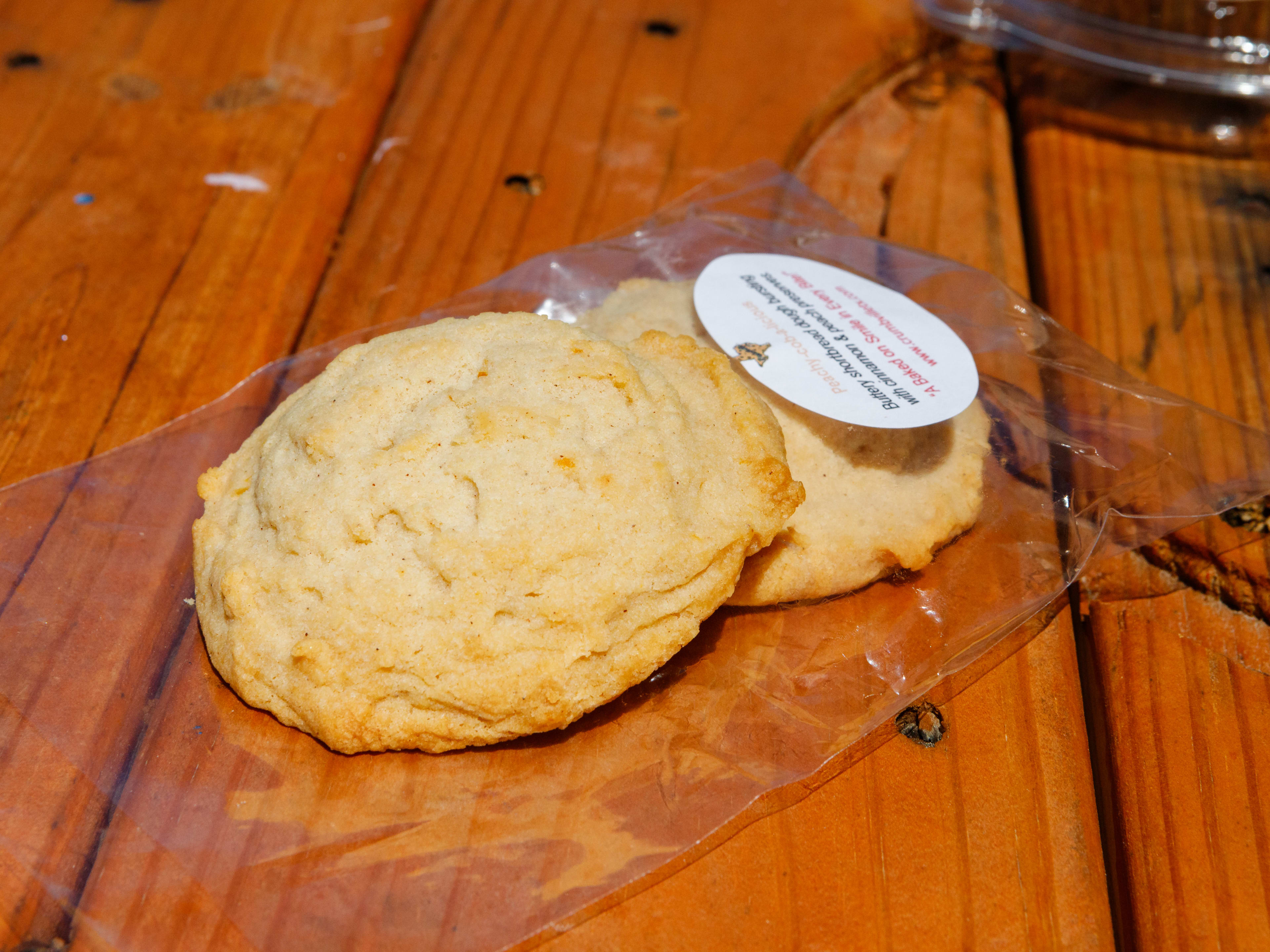 Two peach cobbler shortbread cookies from Crumbville, TX.