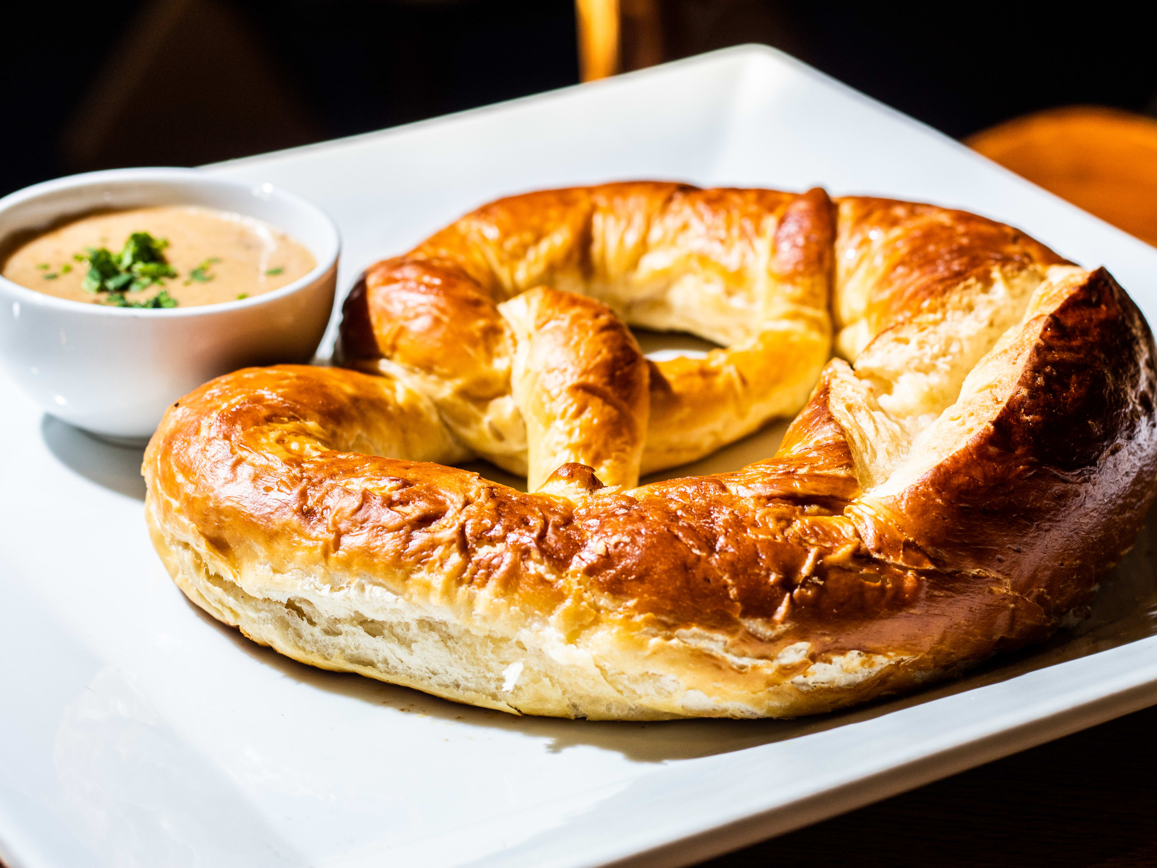 A big pretzel on a plate.