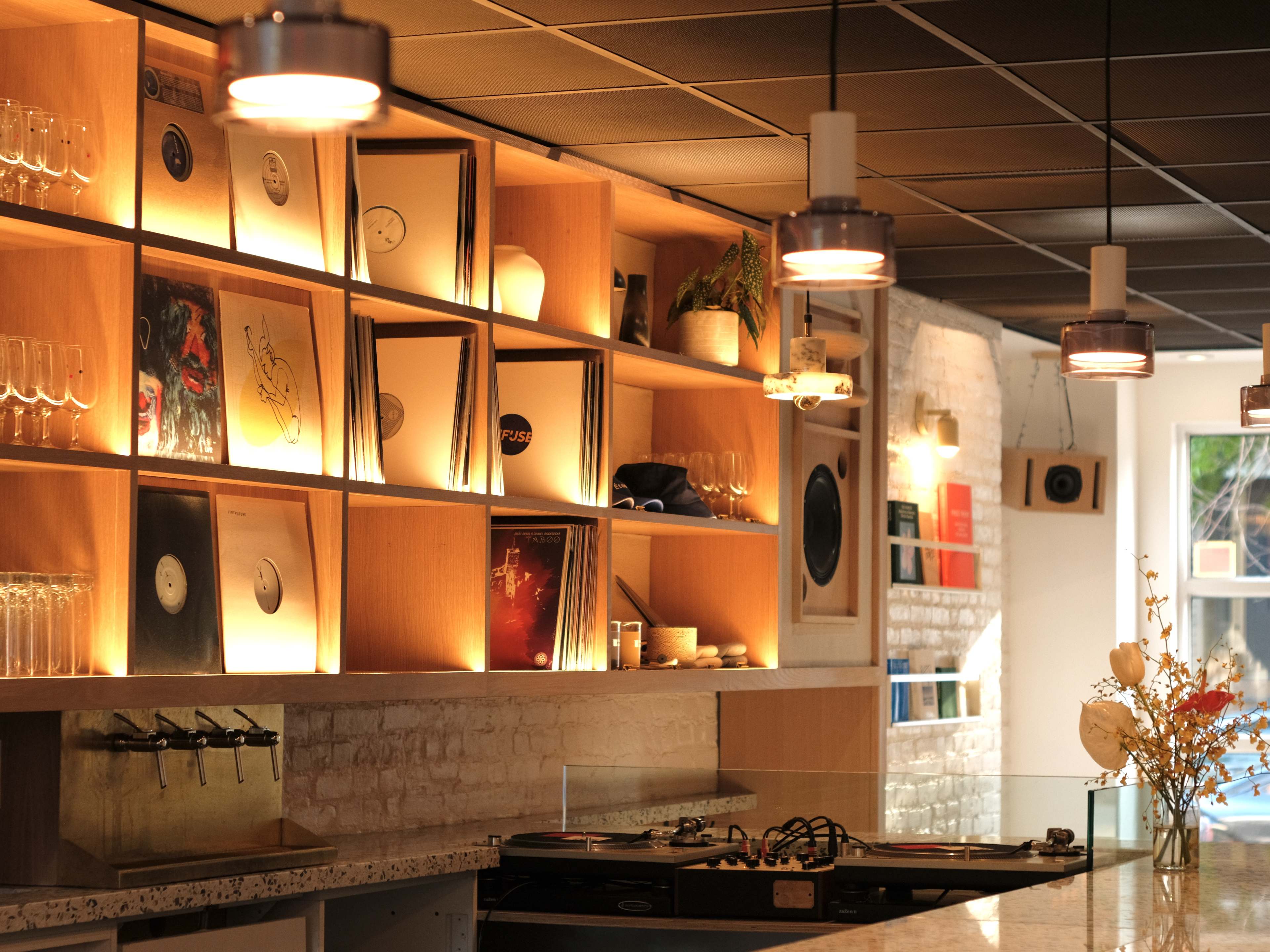 the interior at million goods, with records behind a wine bar