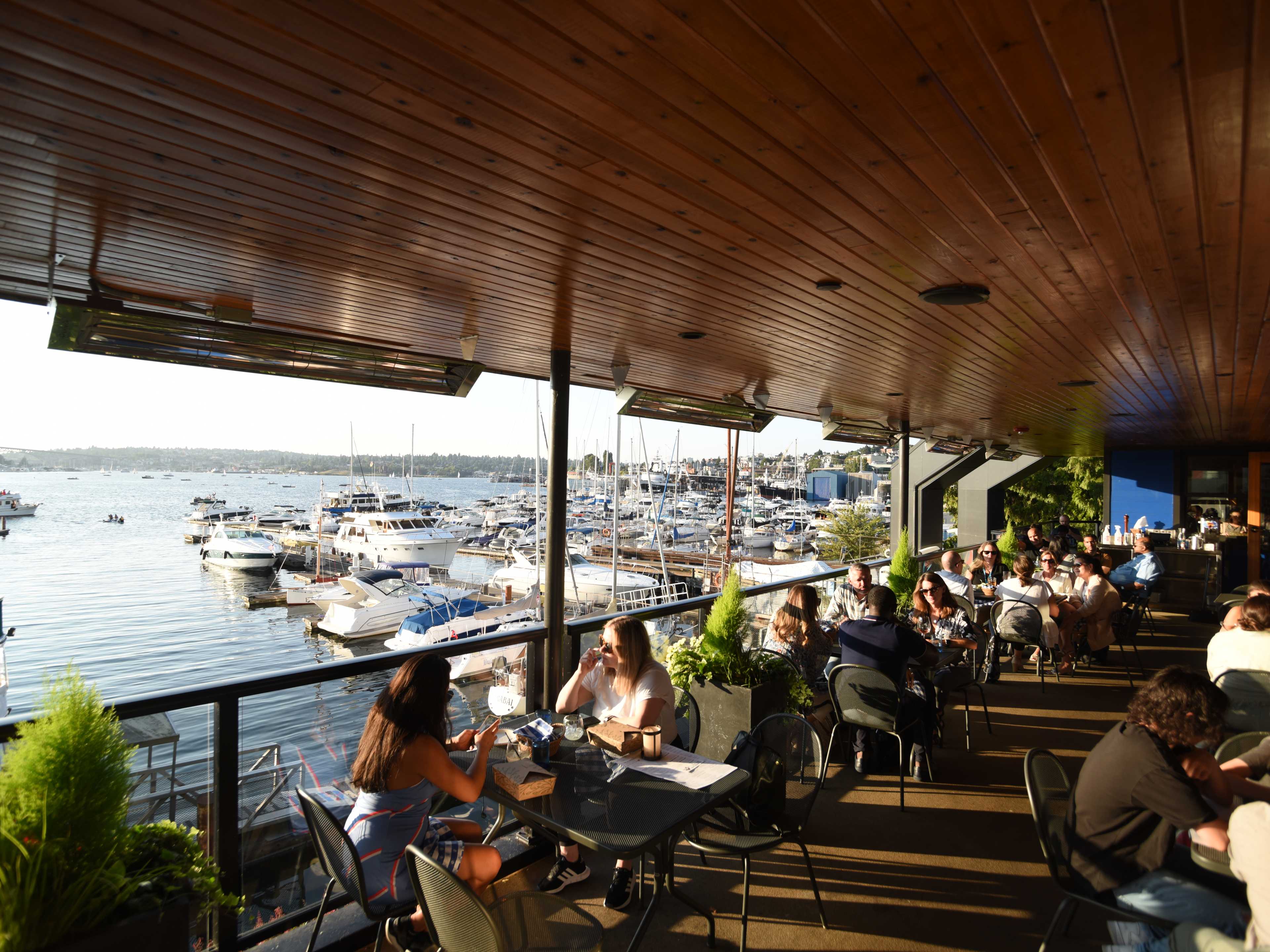 seafood restaurant patio overlooking a marina filled with boats