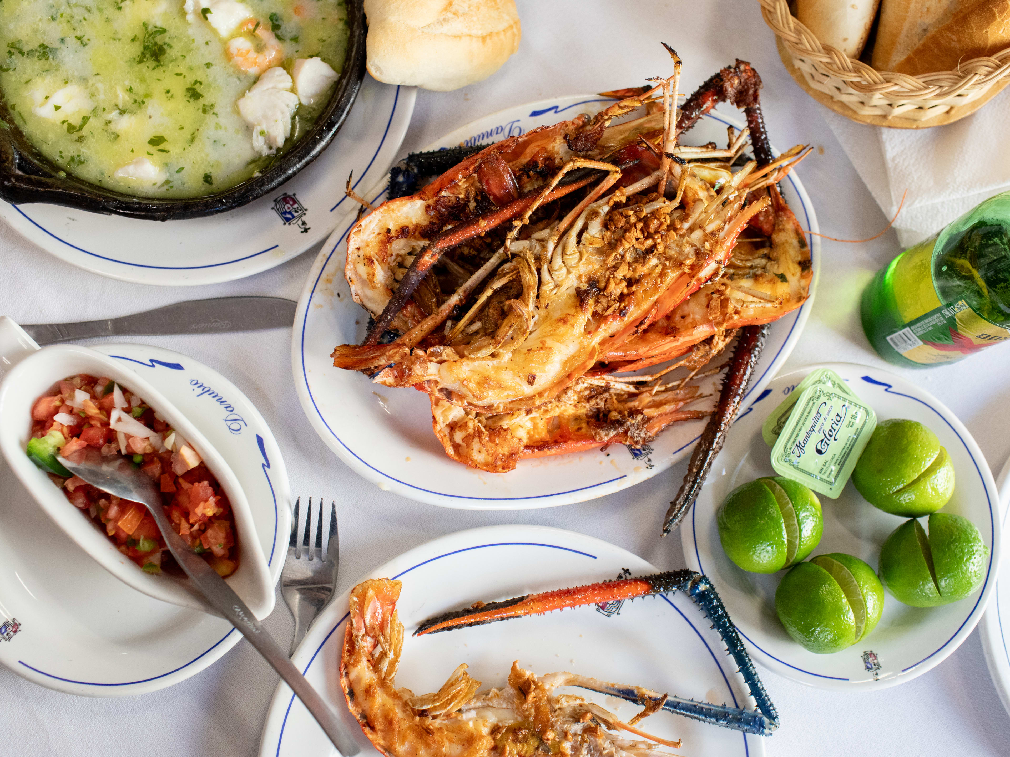 Plates of seafood on a white table cloth at Danubio in Mexico City