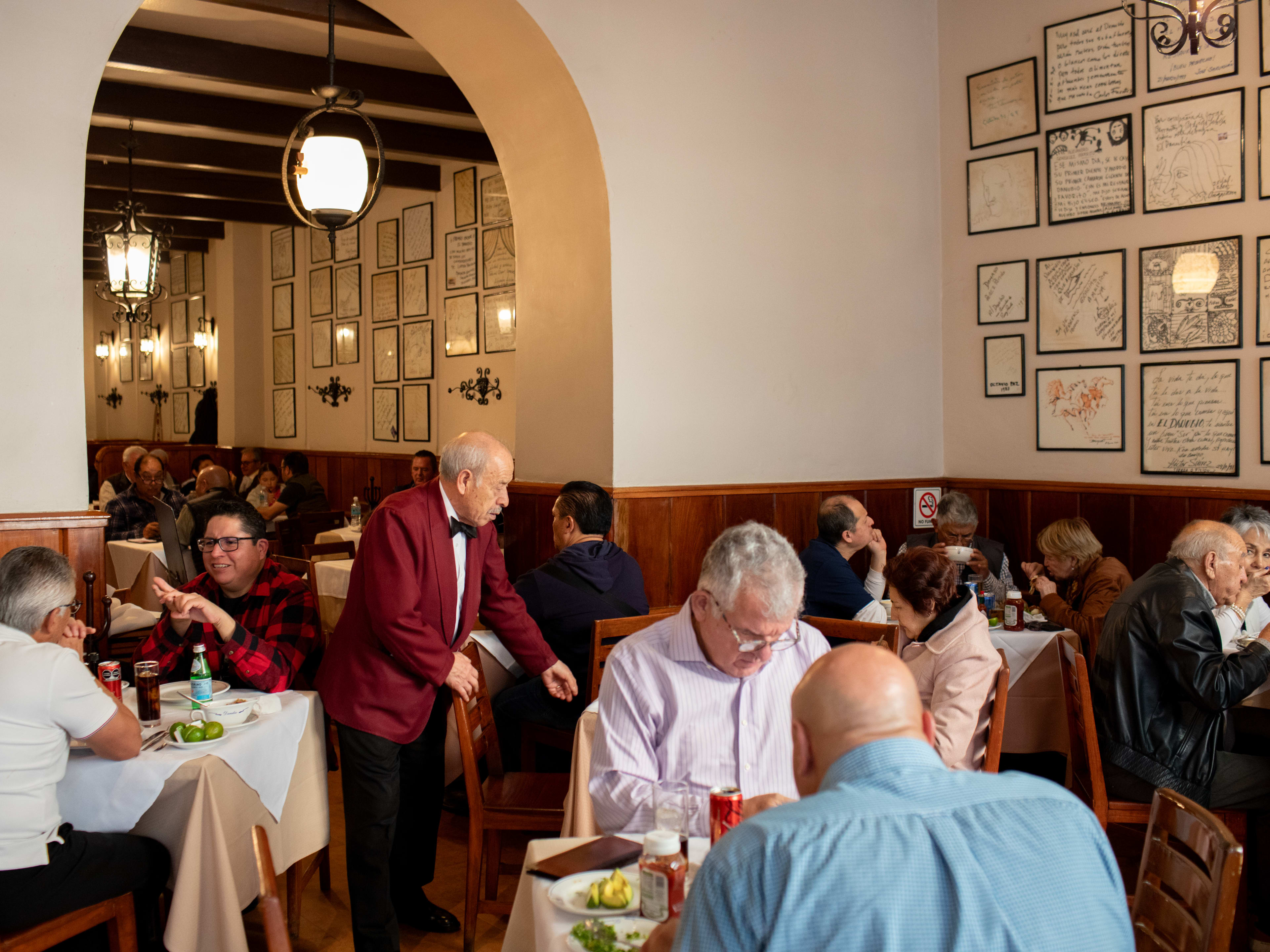 A server waiting tables at Danubio, a popular seafood restaurant in Mexico City