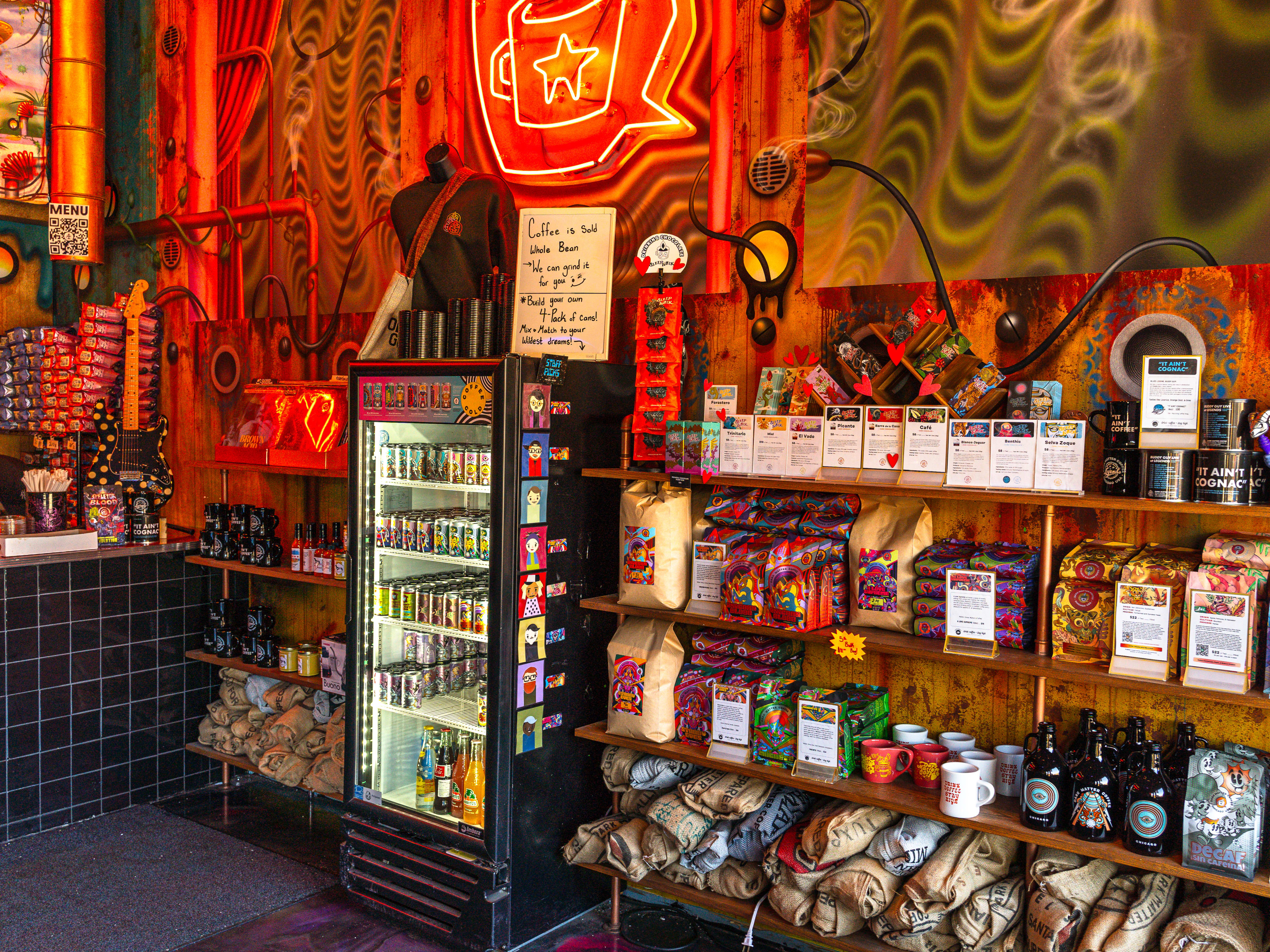 Psychedelic decor, shelving and mini fridge stocked with Dark Matter Coffee at The Mothership