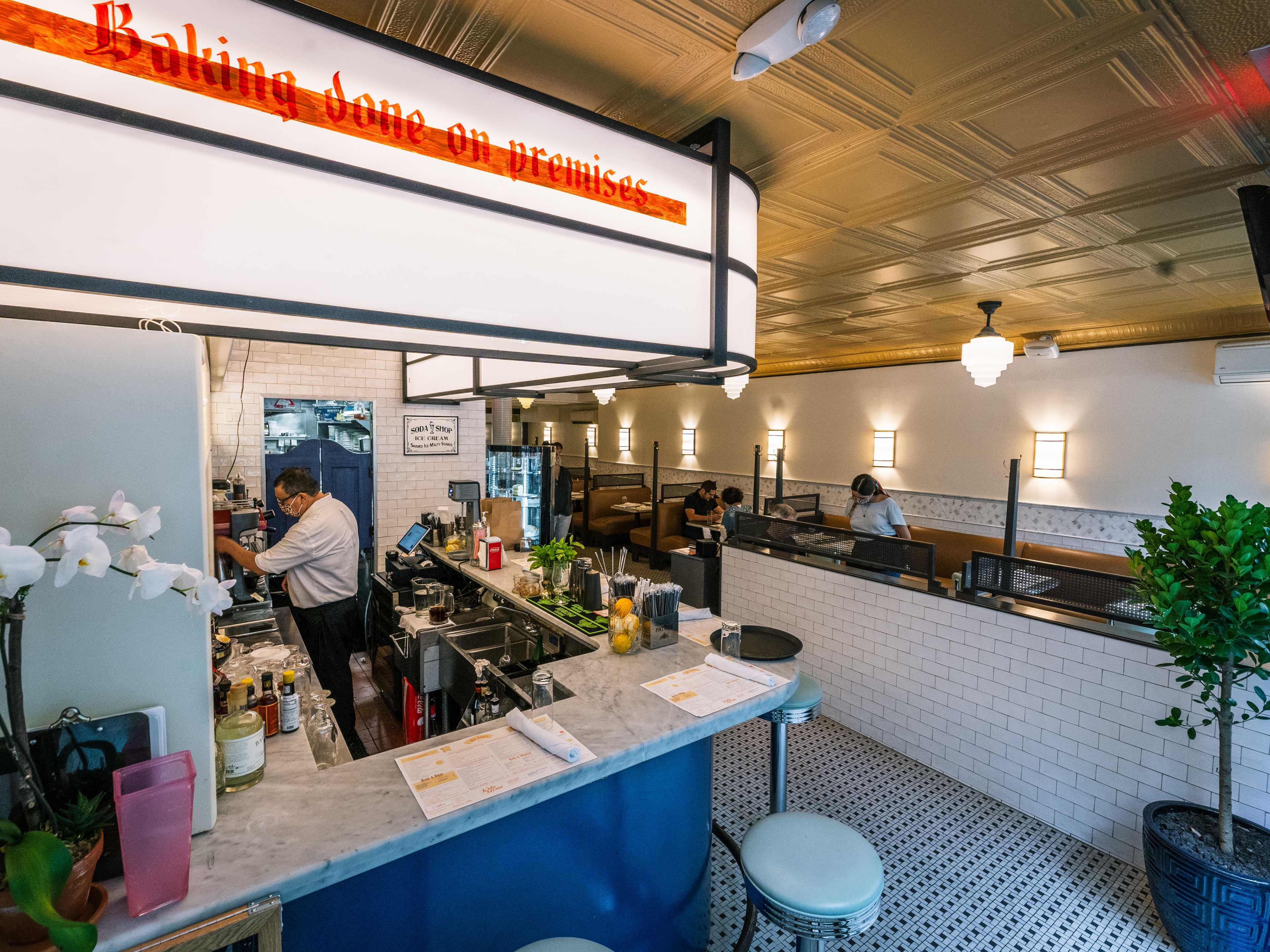 bar counter with sign that says baking done on premises.