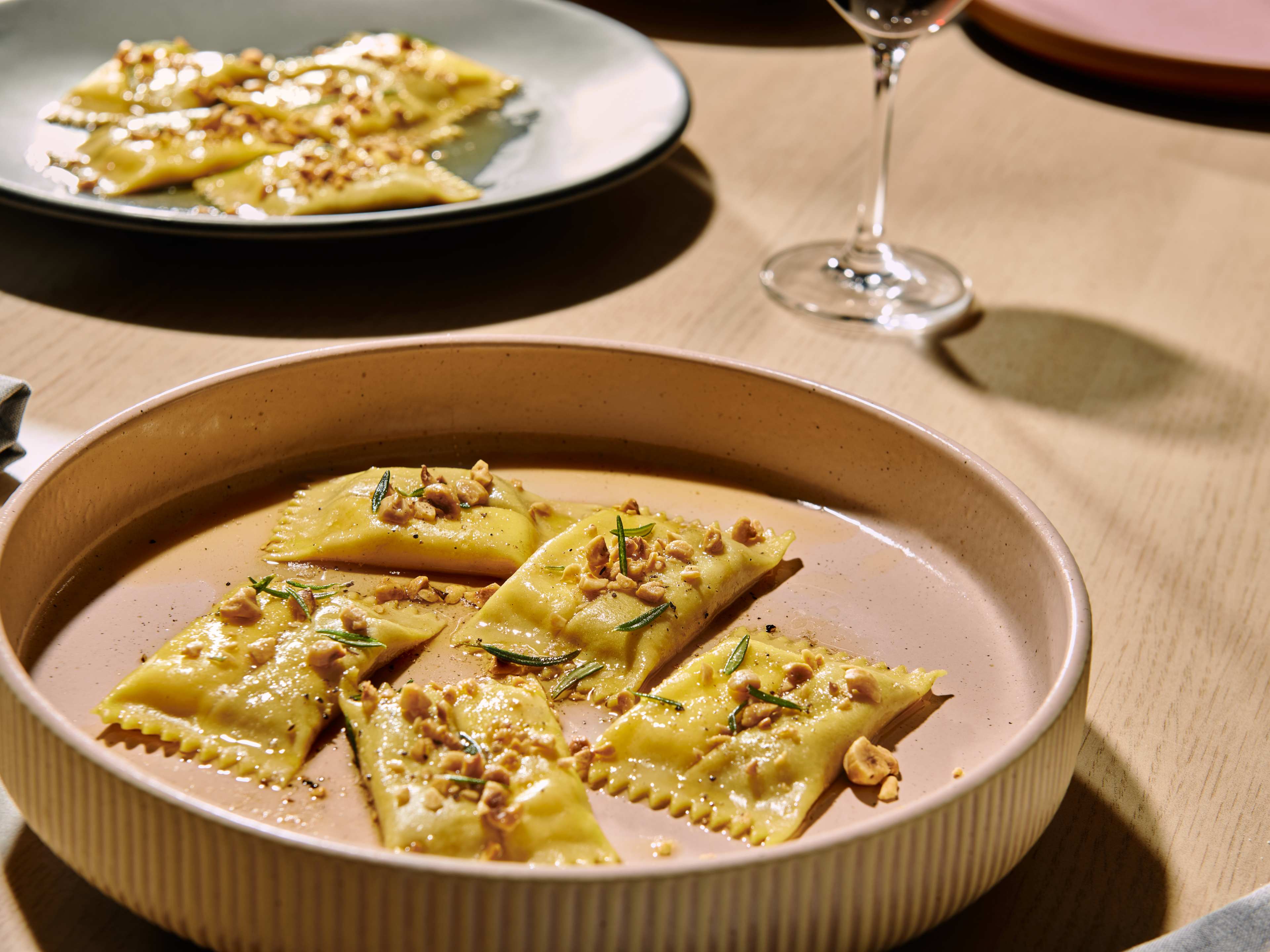 Ravioli topped with rosemary and hazelnuts at Dario