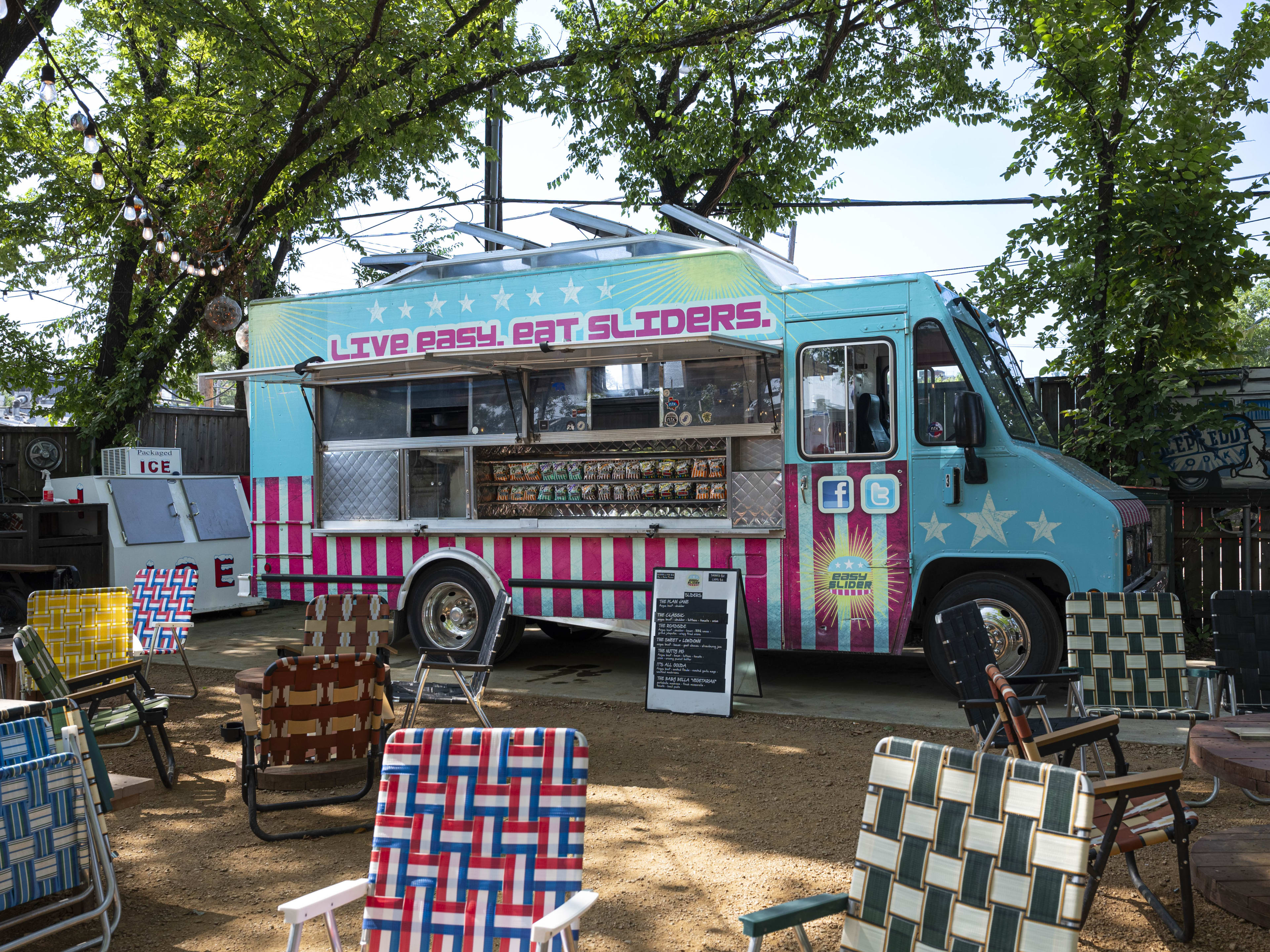 The Easy Slider food truck with picnic tables and chairs