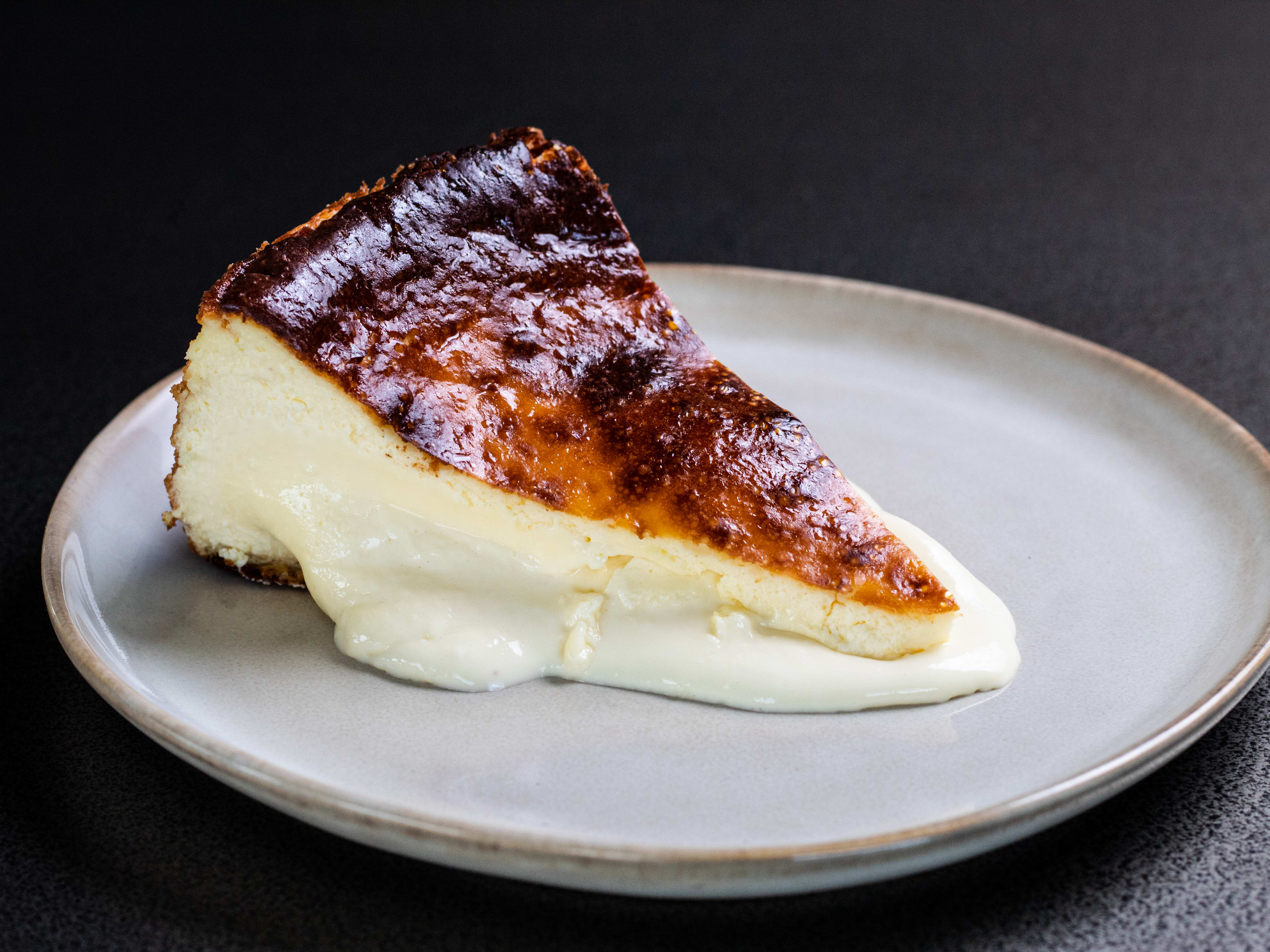 A slice of basque cheesecake with a very creamy center.