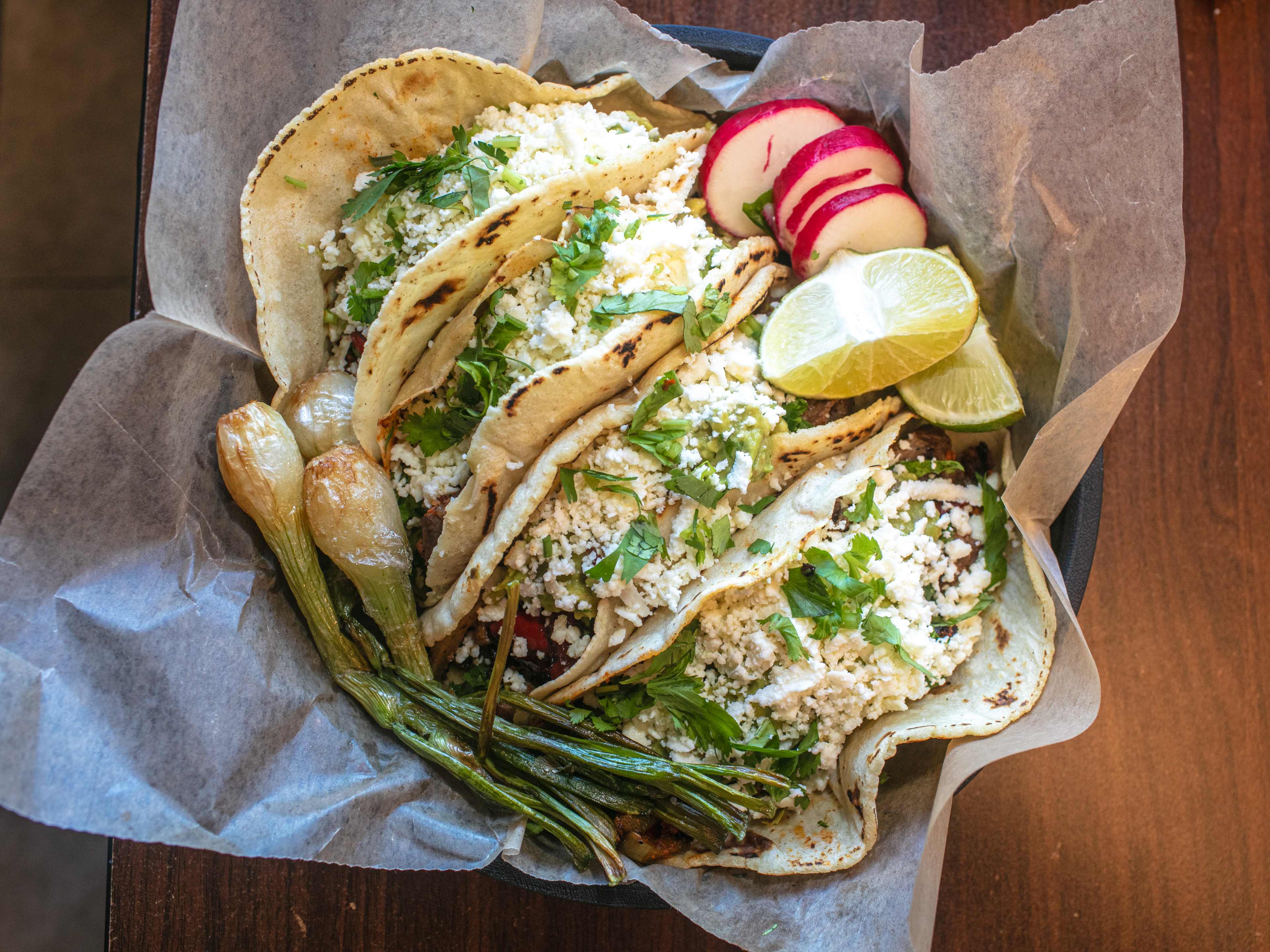 An overhead shot of tacos on a table