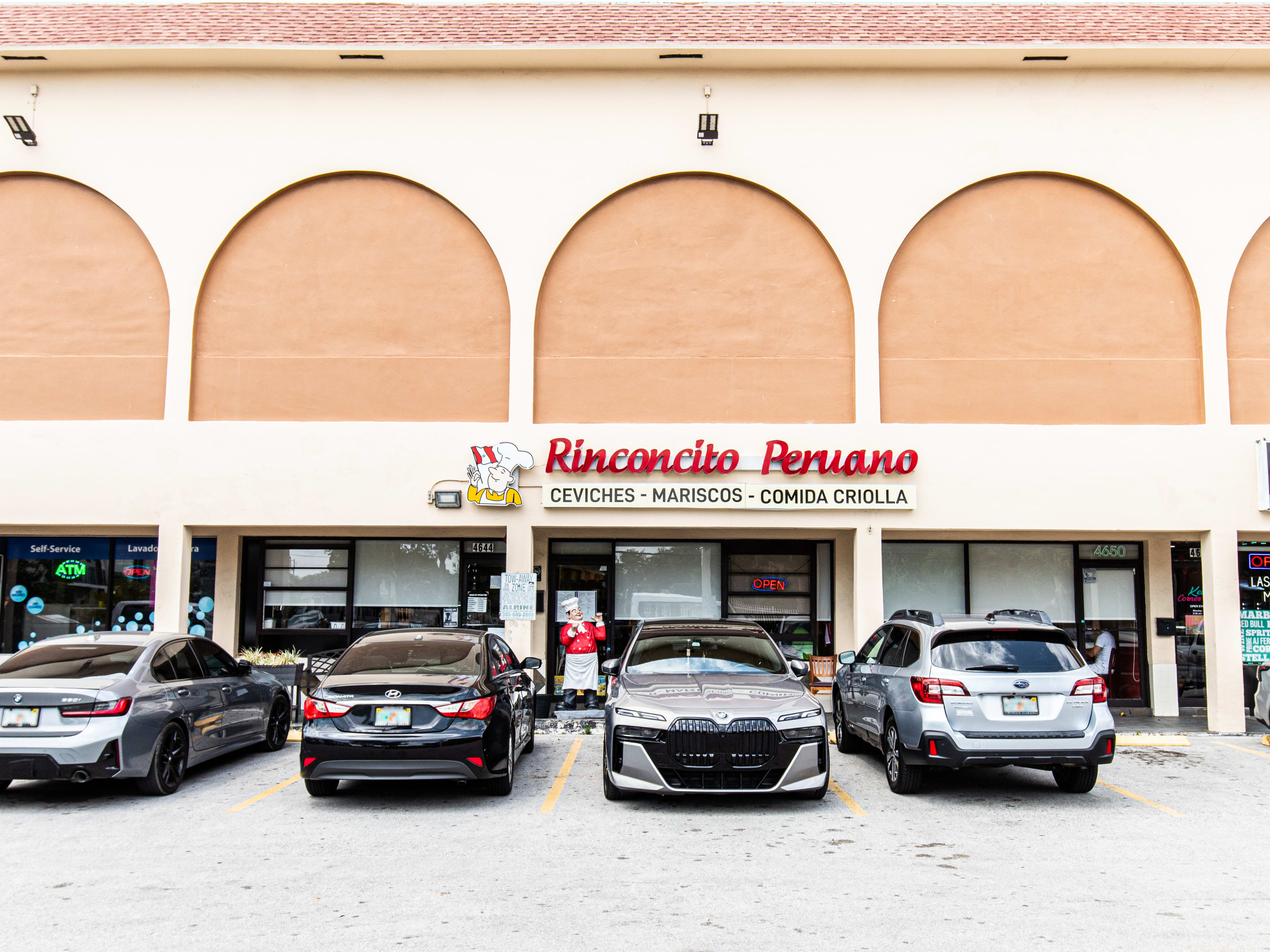 Outdoor of strip mall and Peruvian restaurant