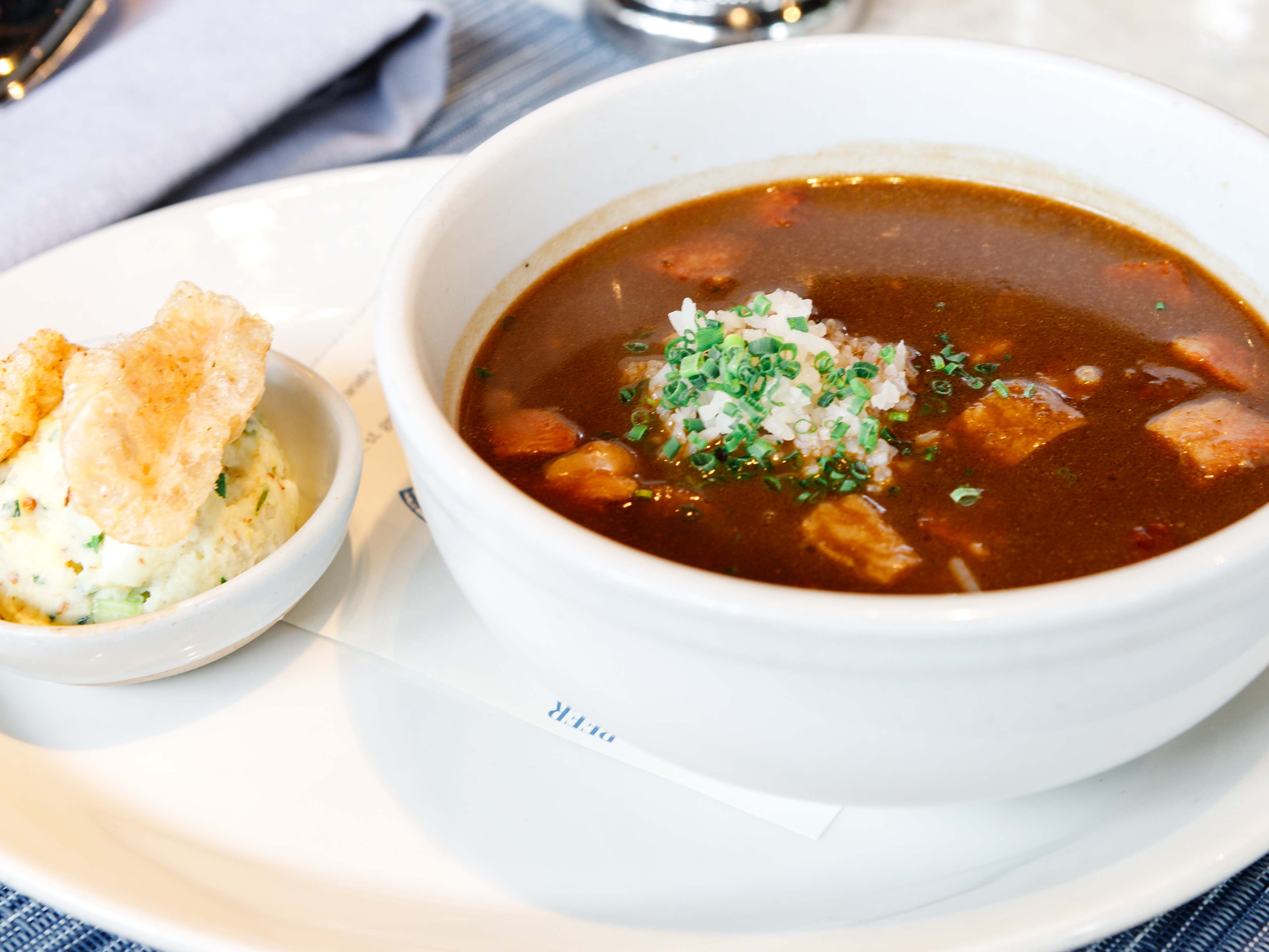 A bowl of gumbo and a side of mashed potatoes at Eunice.