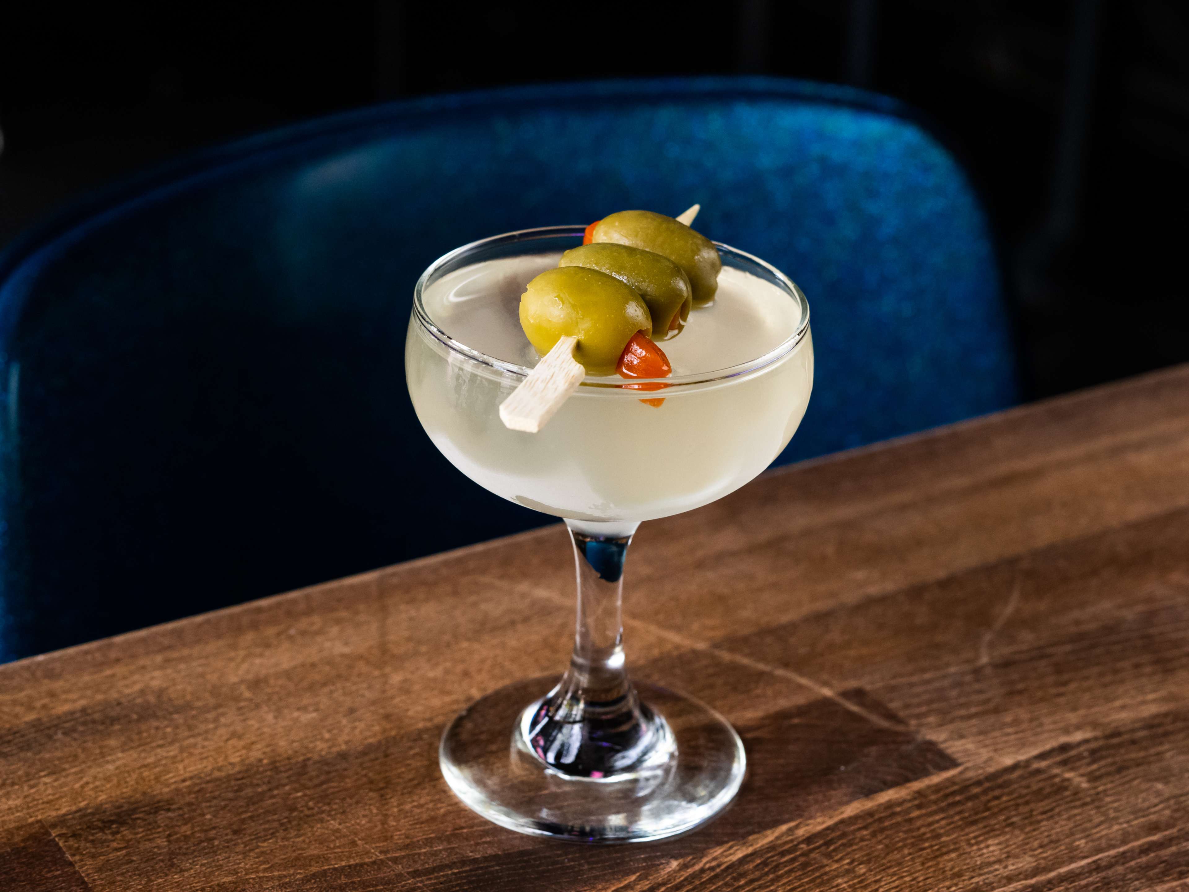 A martini with olives.