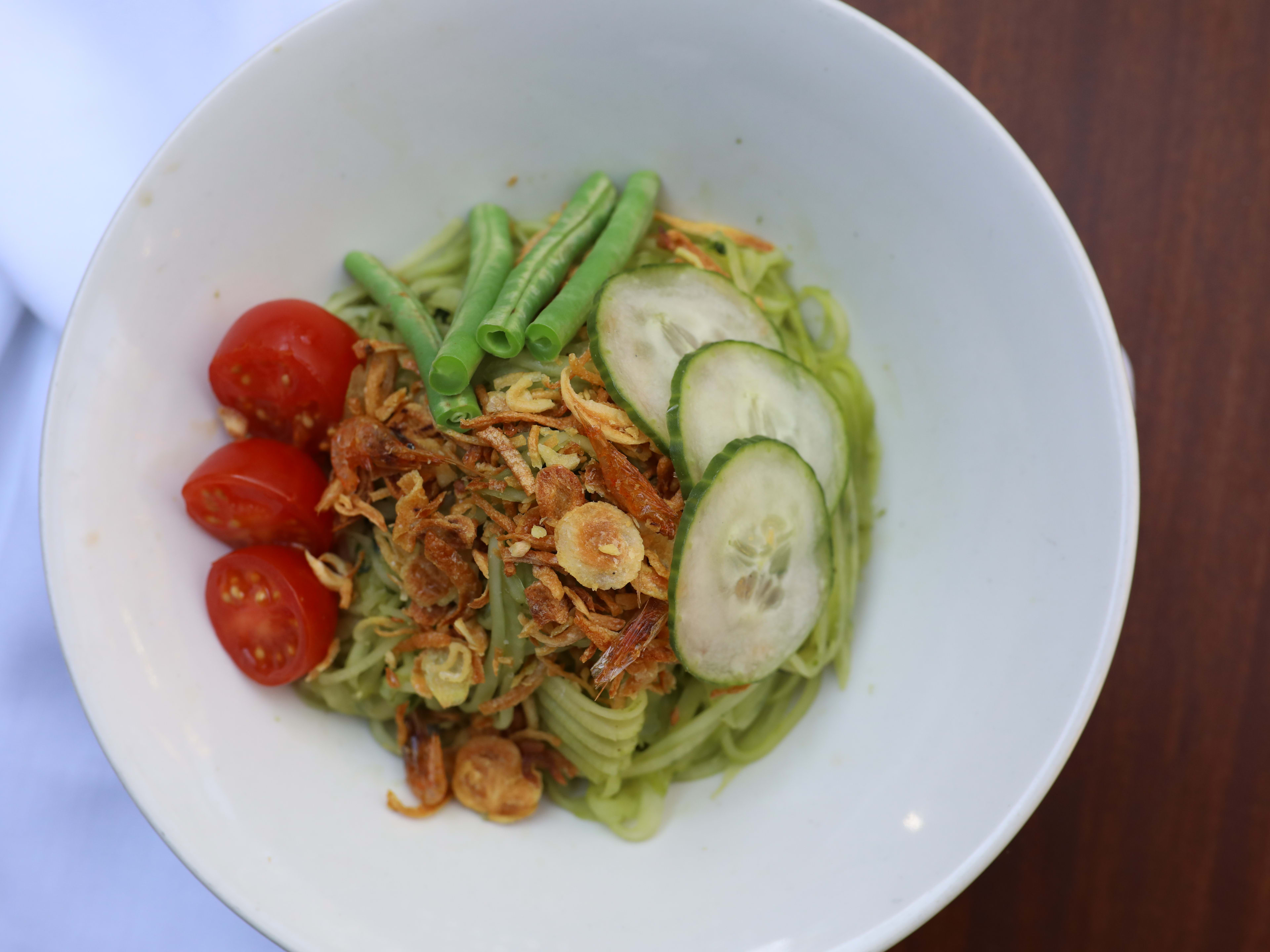 A dish with noodles, vegetables and nuts from Sway.