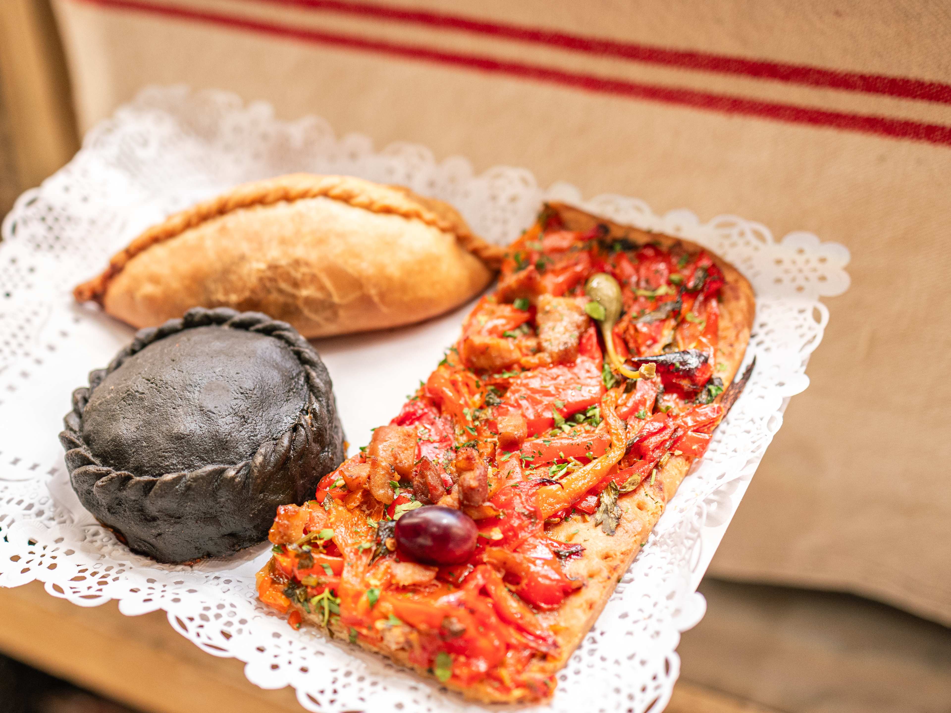 tray of pizza and pastries