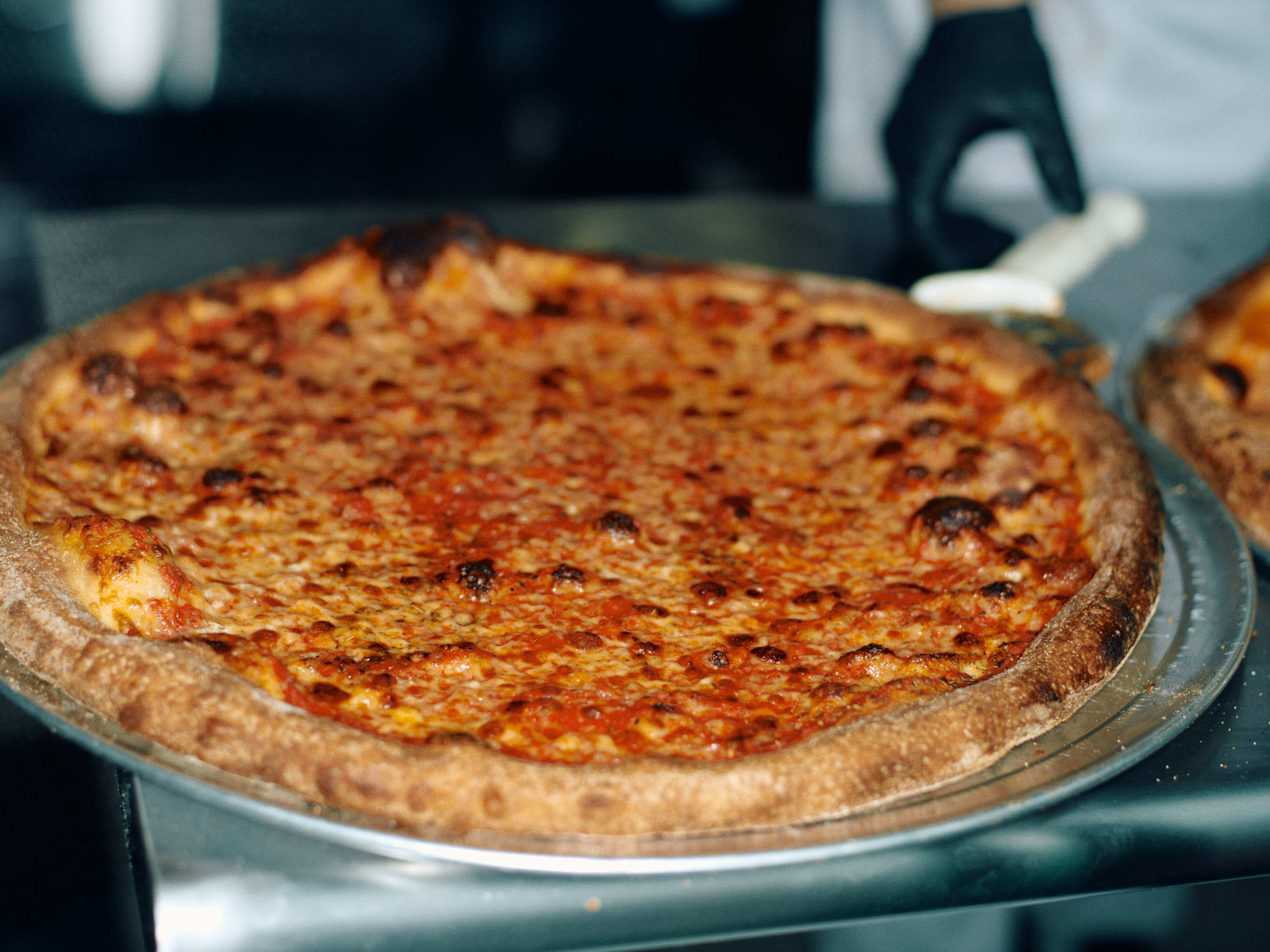 A plain pizza at Lucia Pizza of Soho.