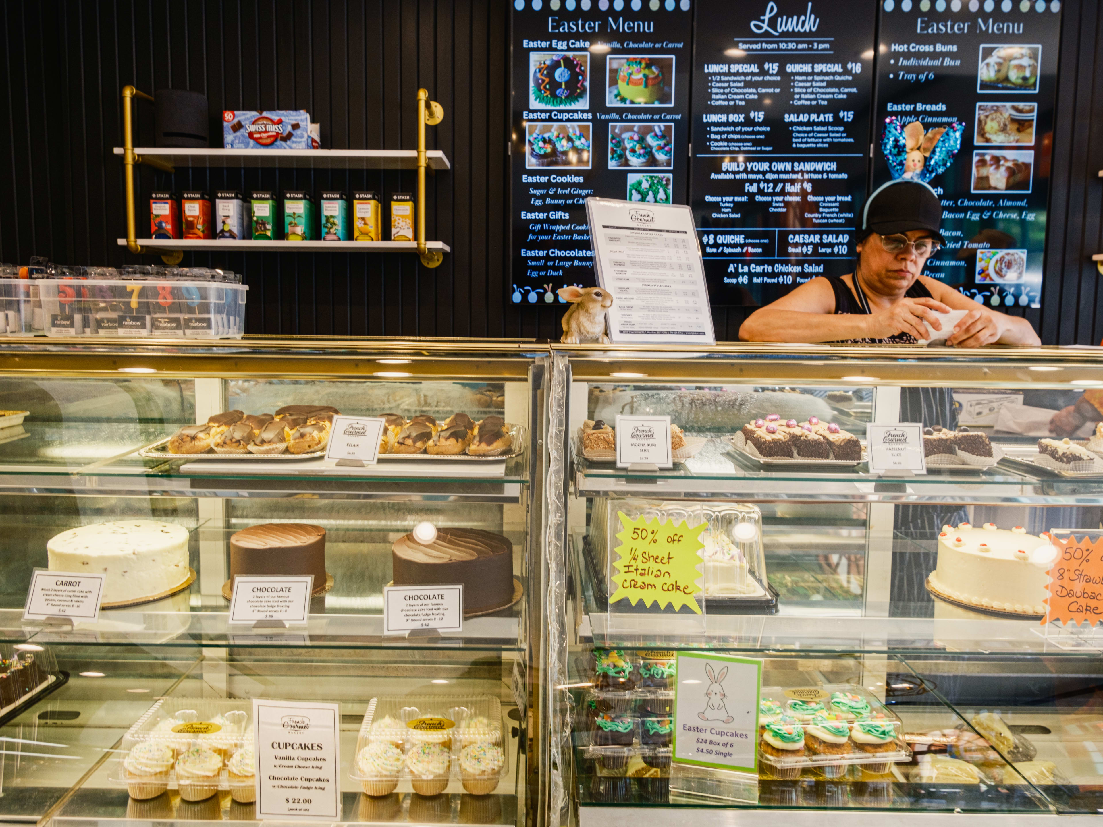 Cakes and cupcakes inside the pastry case at French Gourmet.