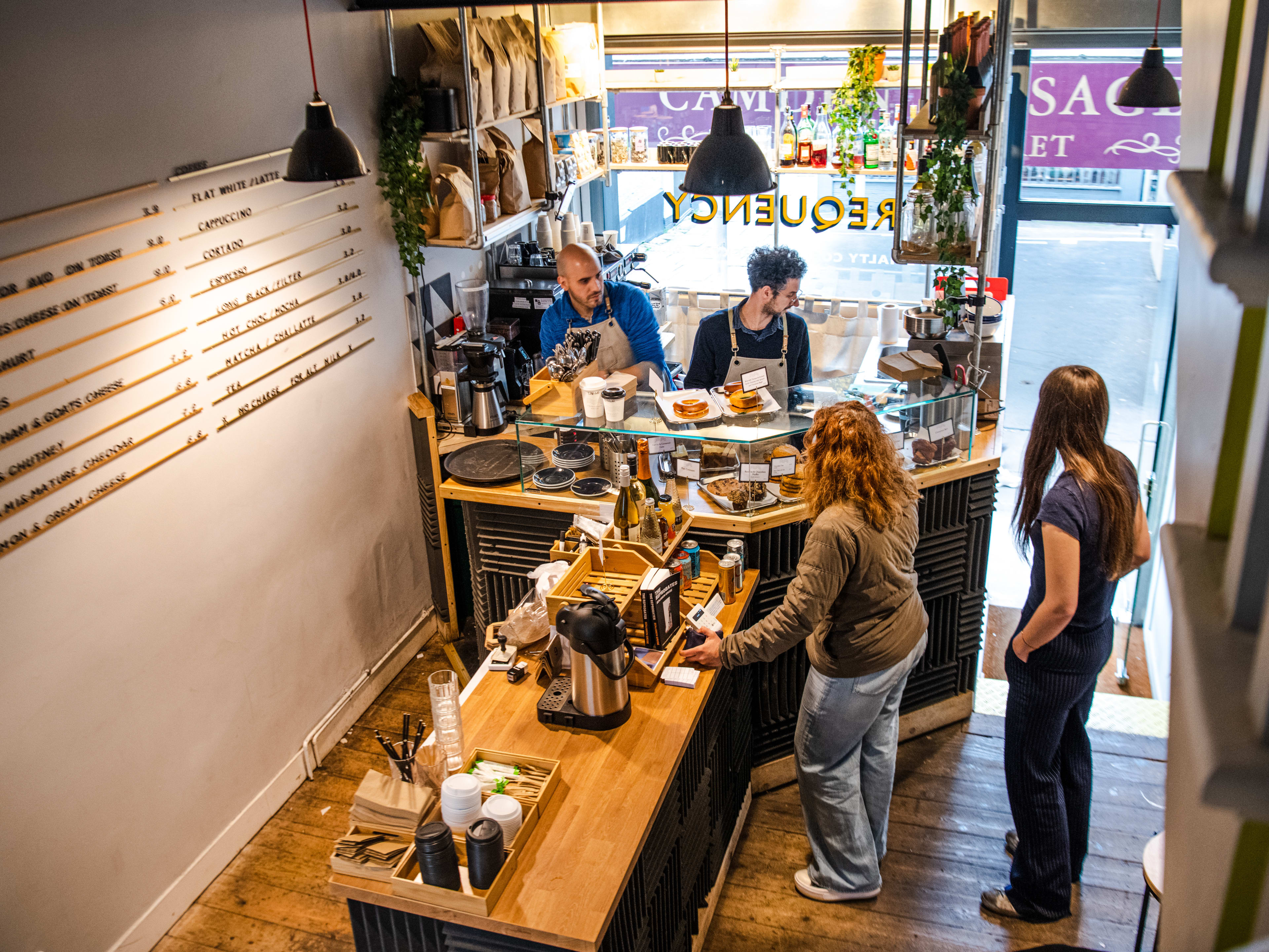 A view of the coffee counter at Frequency Coffee from the second floor.