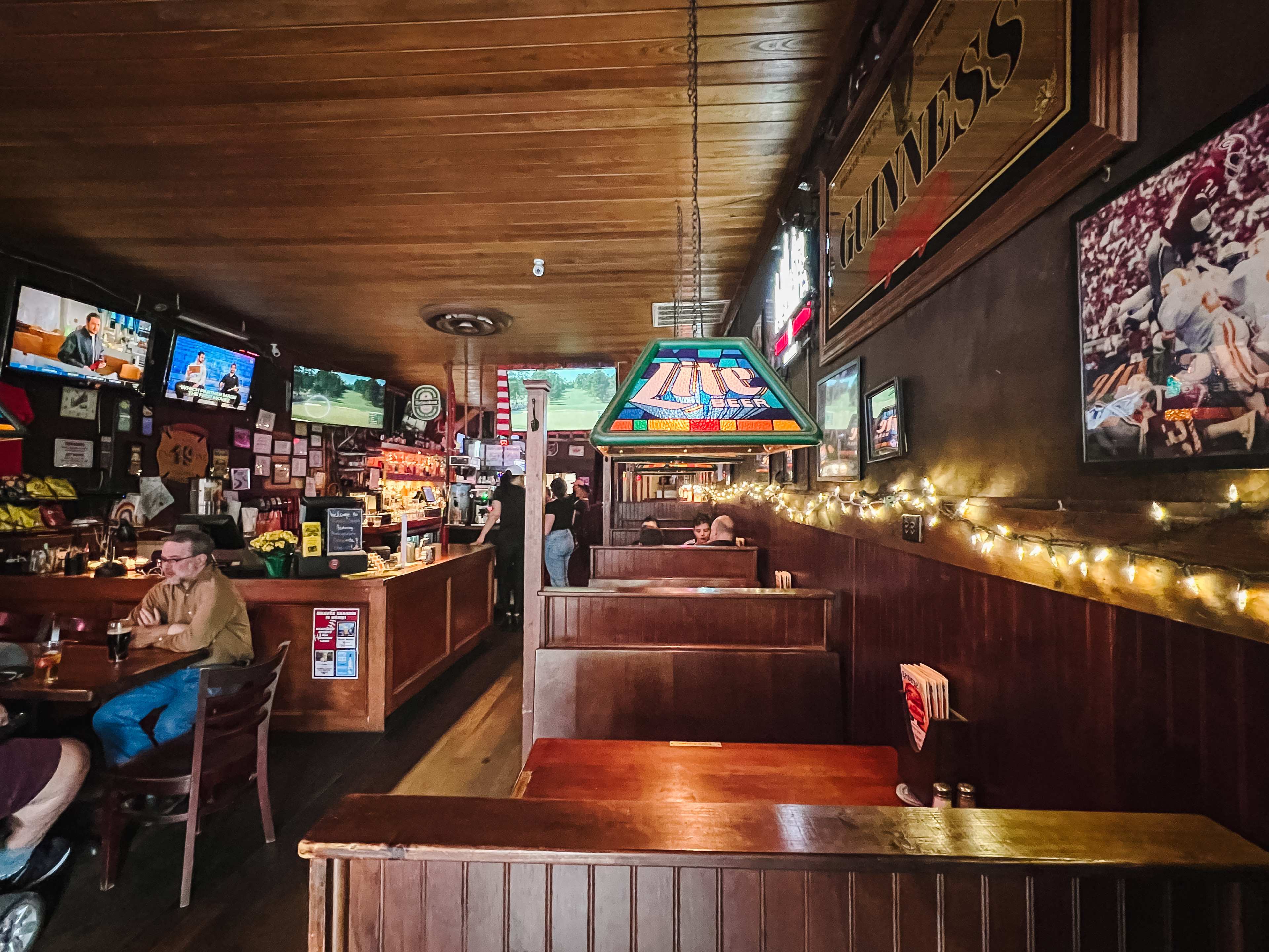 Wooden booths and the bar of George's.