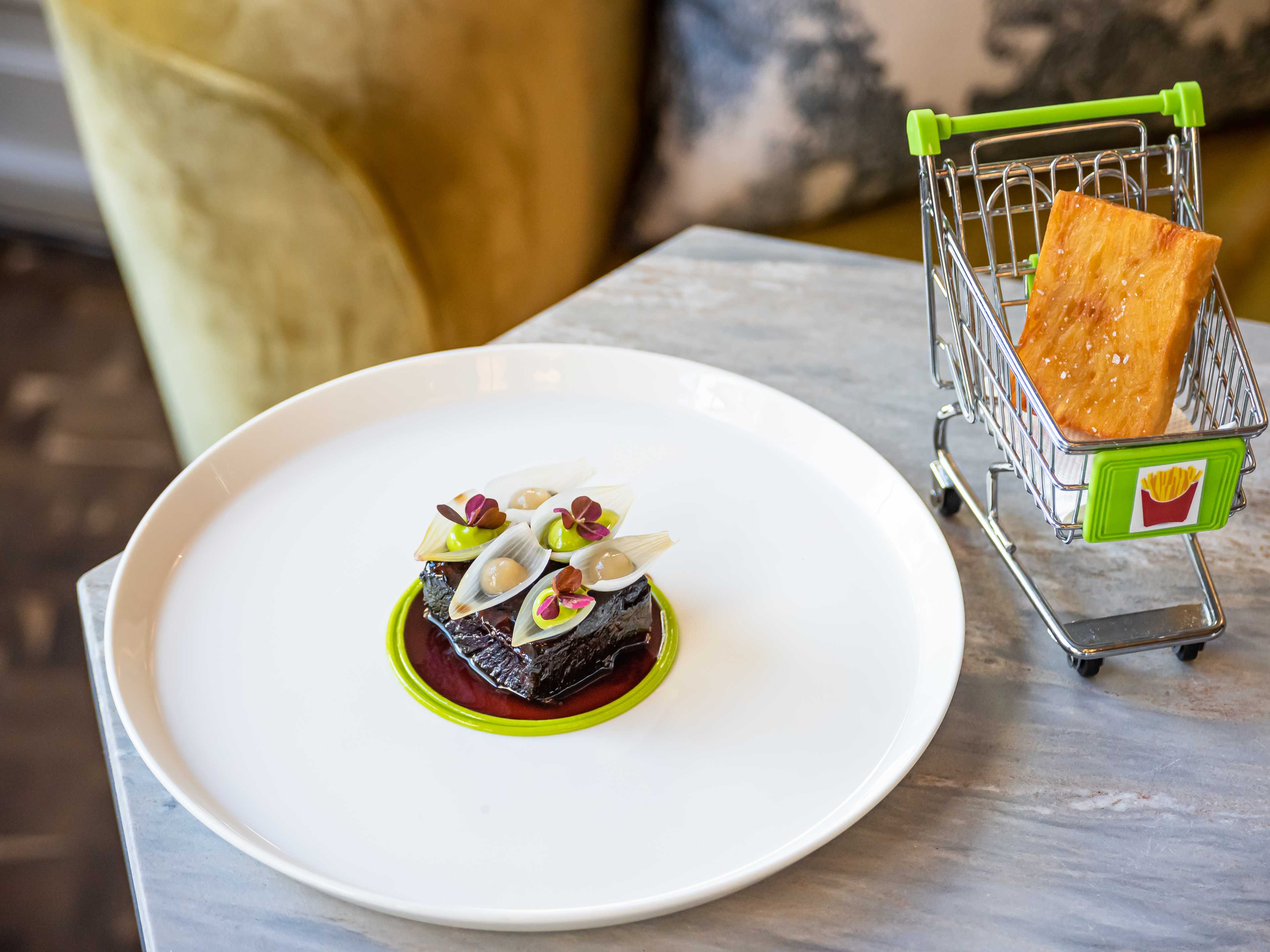 The short rib dish with a "chip trolley." The trolley is a miniature shopping cart.