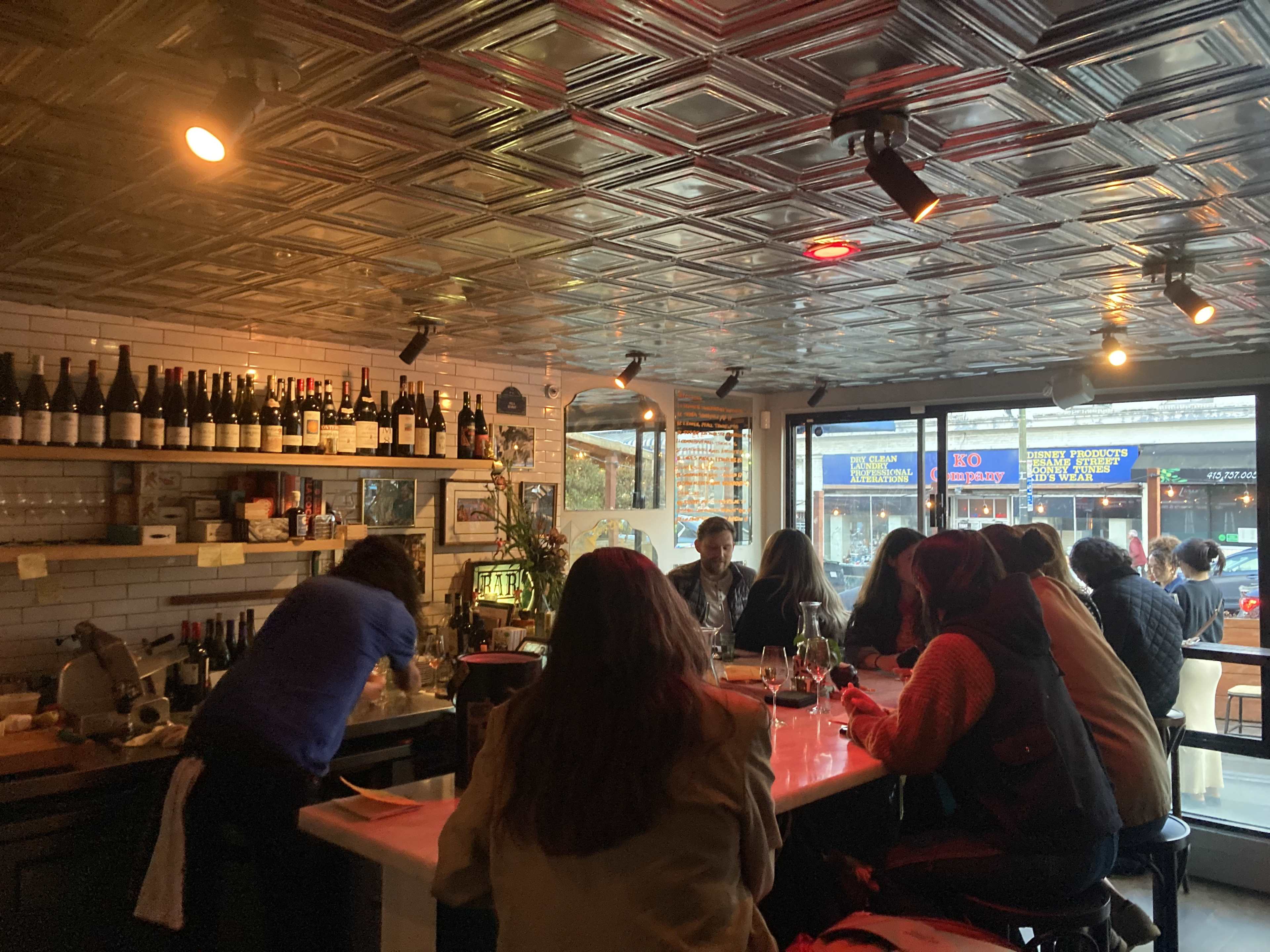 A few people at the bar at Golden Sardine in San Francisco.