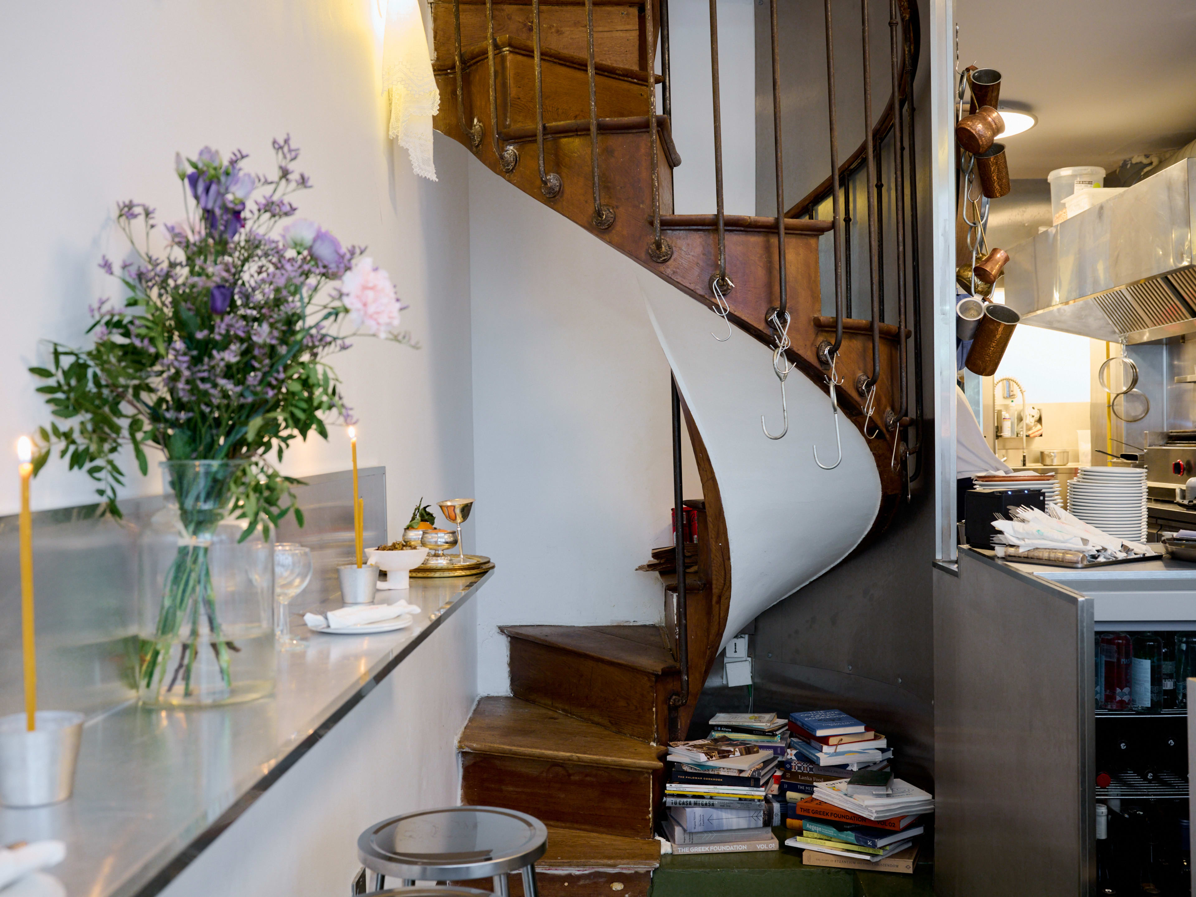 Spiral staircase in interior dining area at Taverna