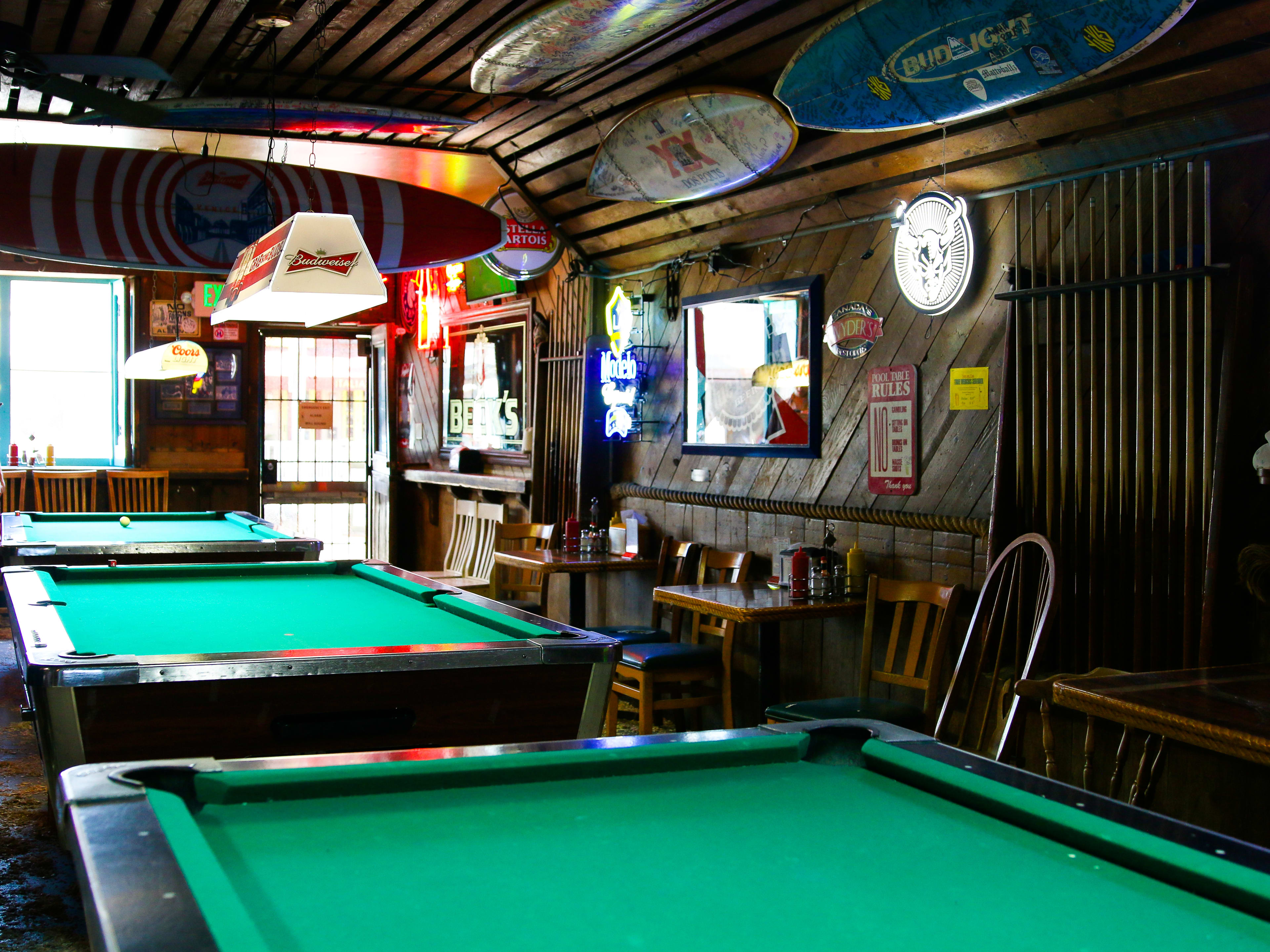 The line of pool tables at Hinano Cafe.