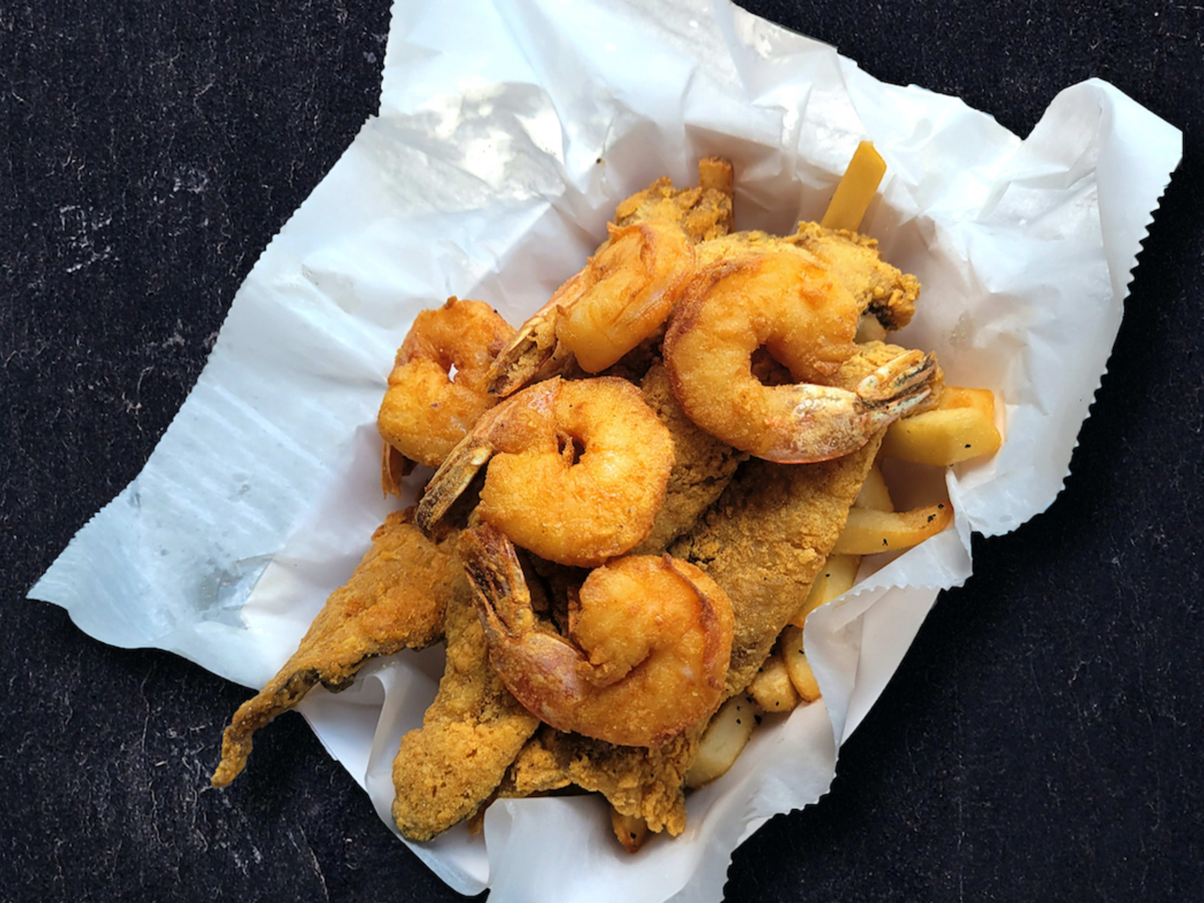 a pile of fried shrimp and catfish