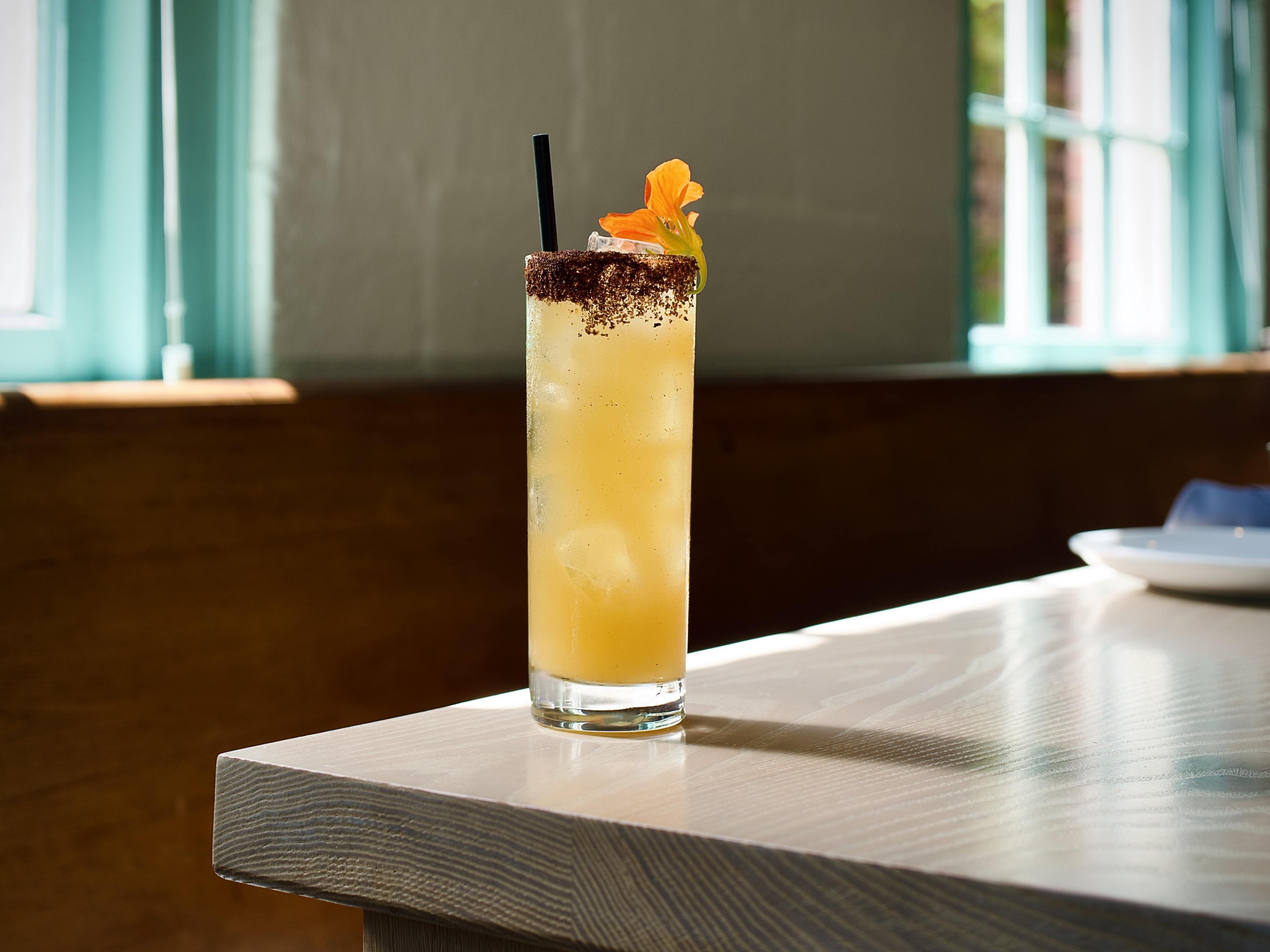 orange cocktail on table