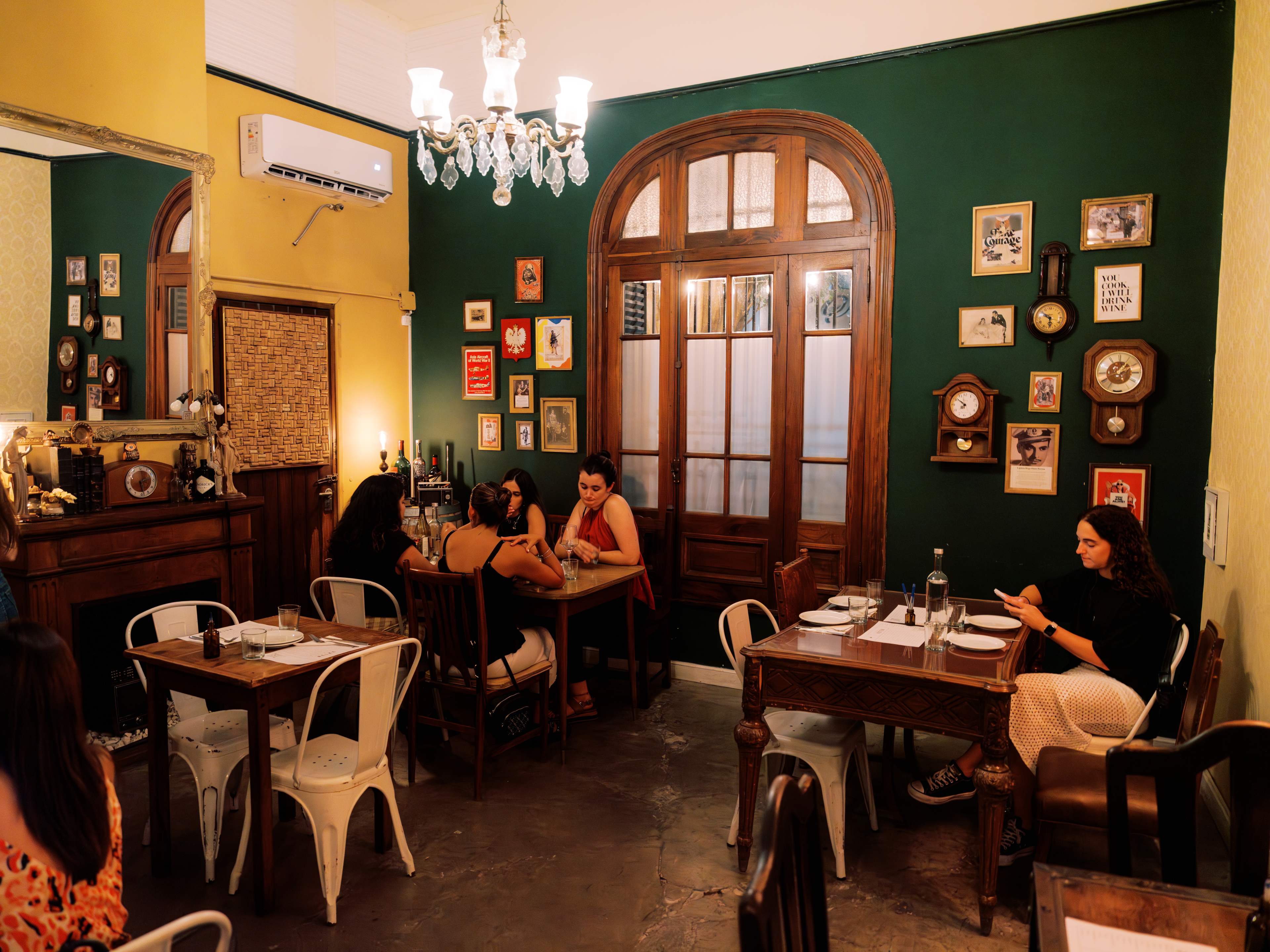 Cozy dimly lit interior dining room with patrons.