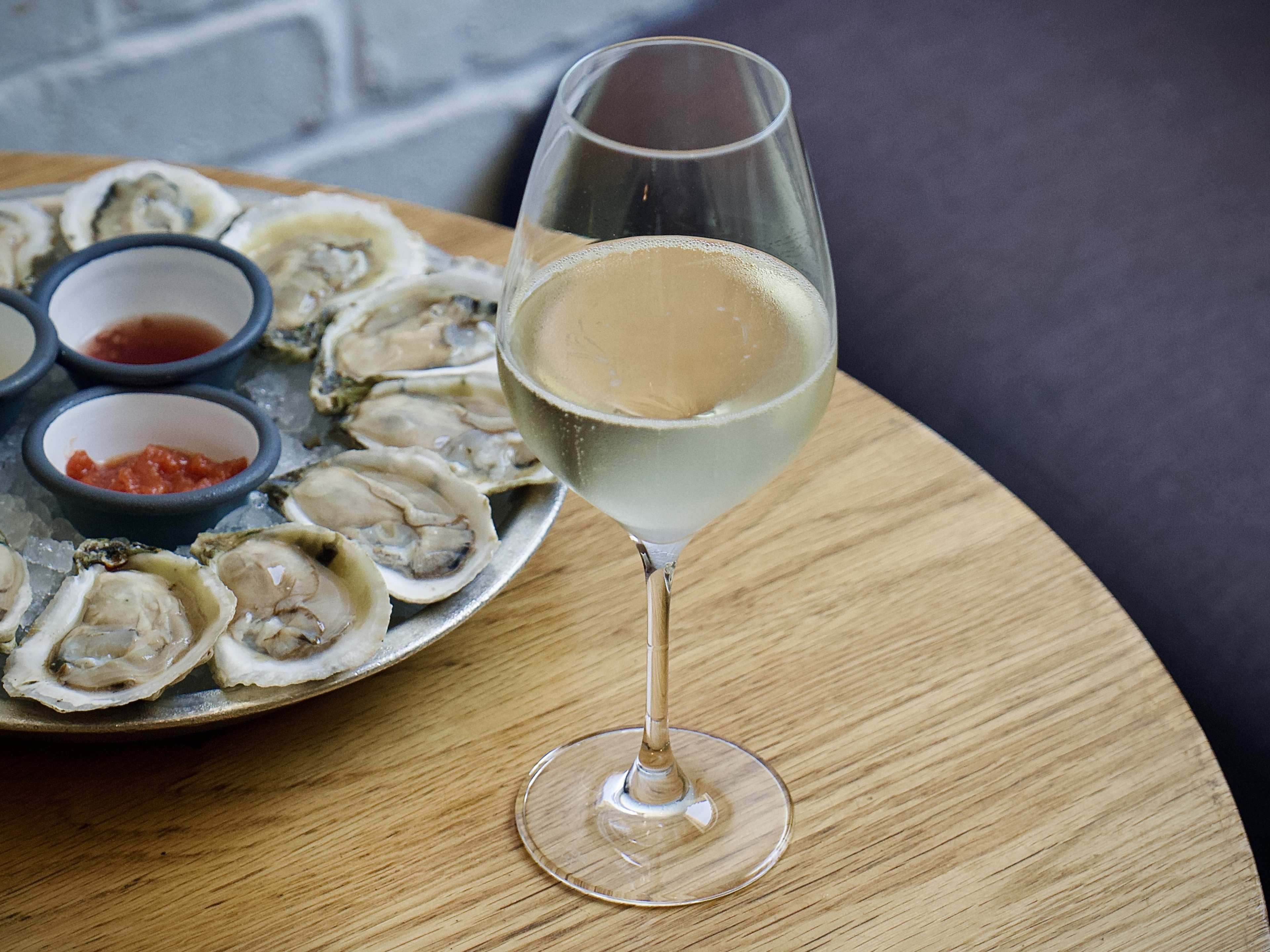 cava and oysters on table