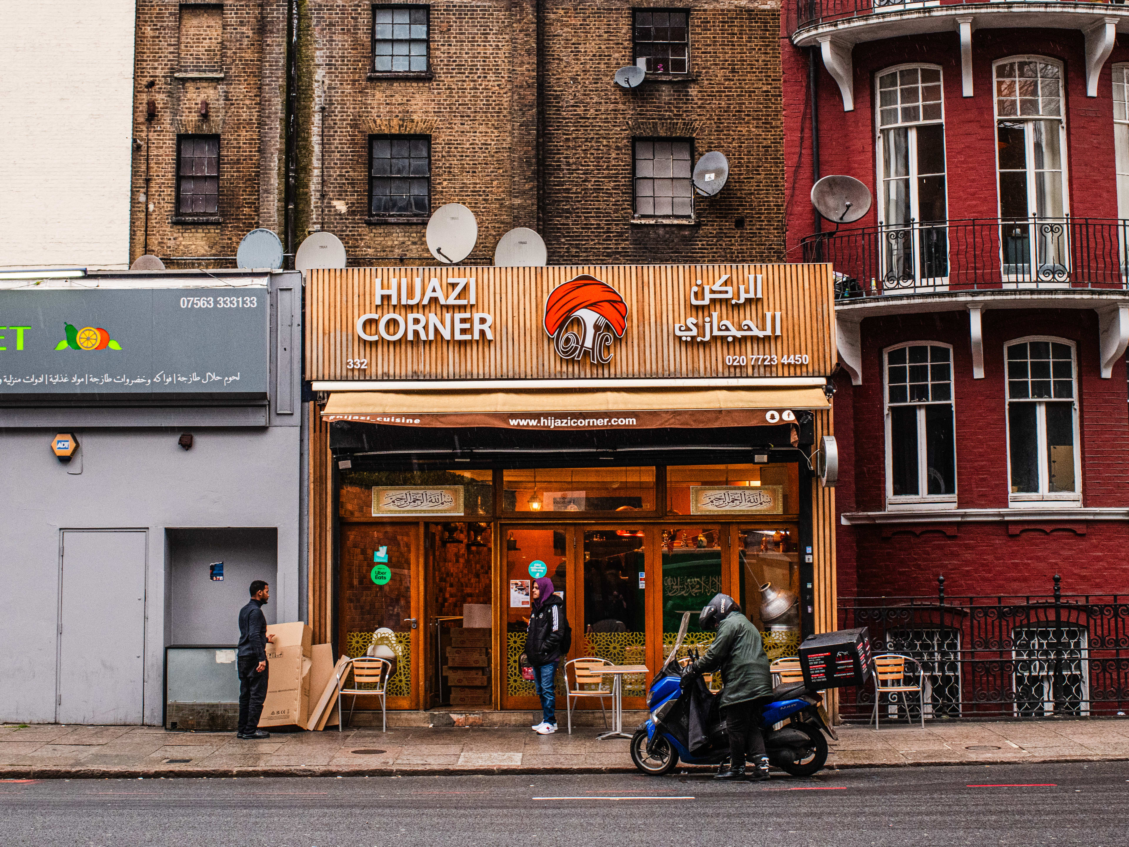 Exterior of restaurant with "Hijaazi Corner' signage.