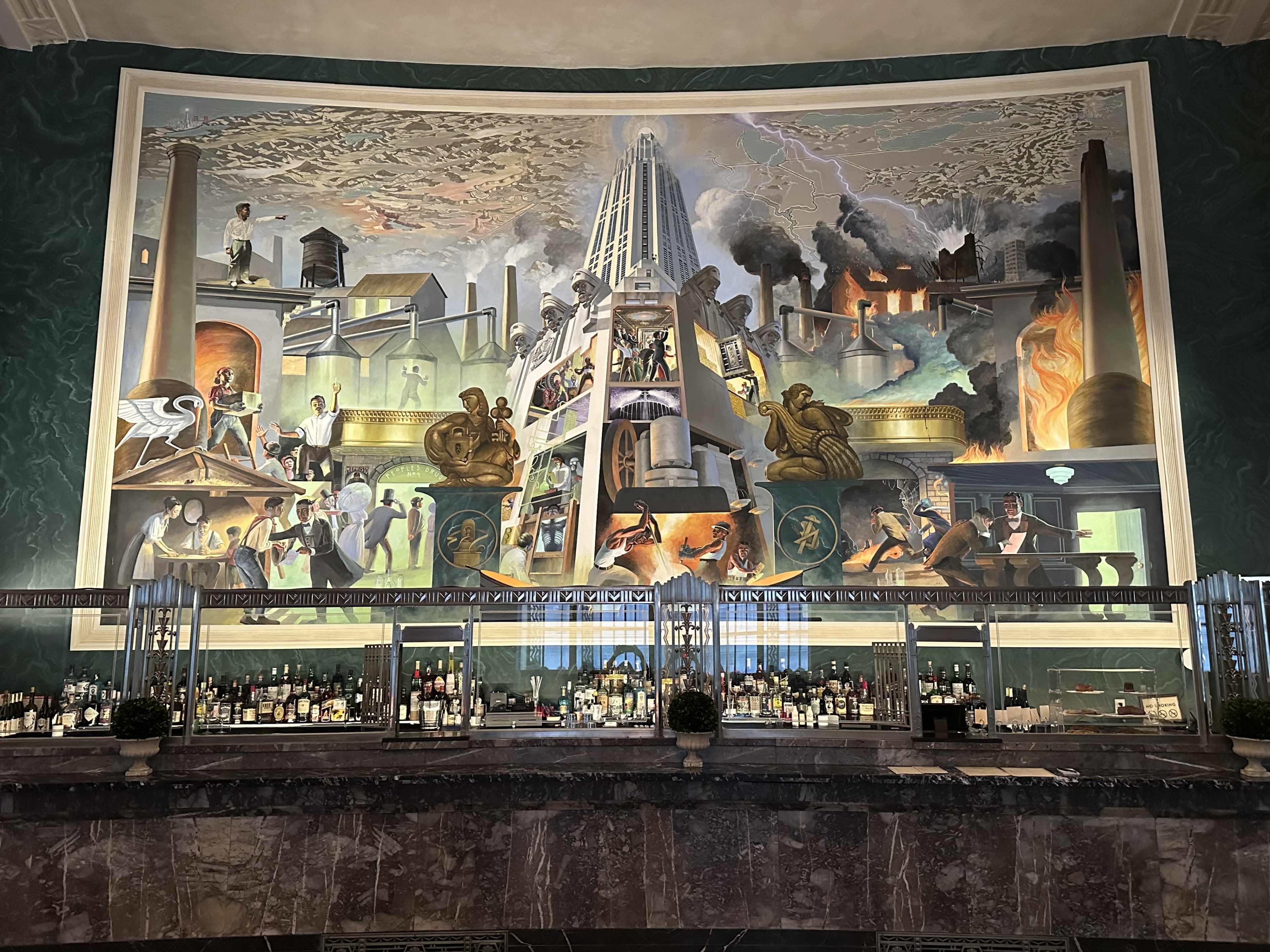 A cityscape mural showing factories and a skyscraper at Conwell Coffee Hall