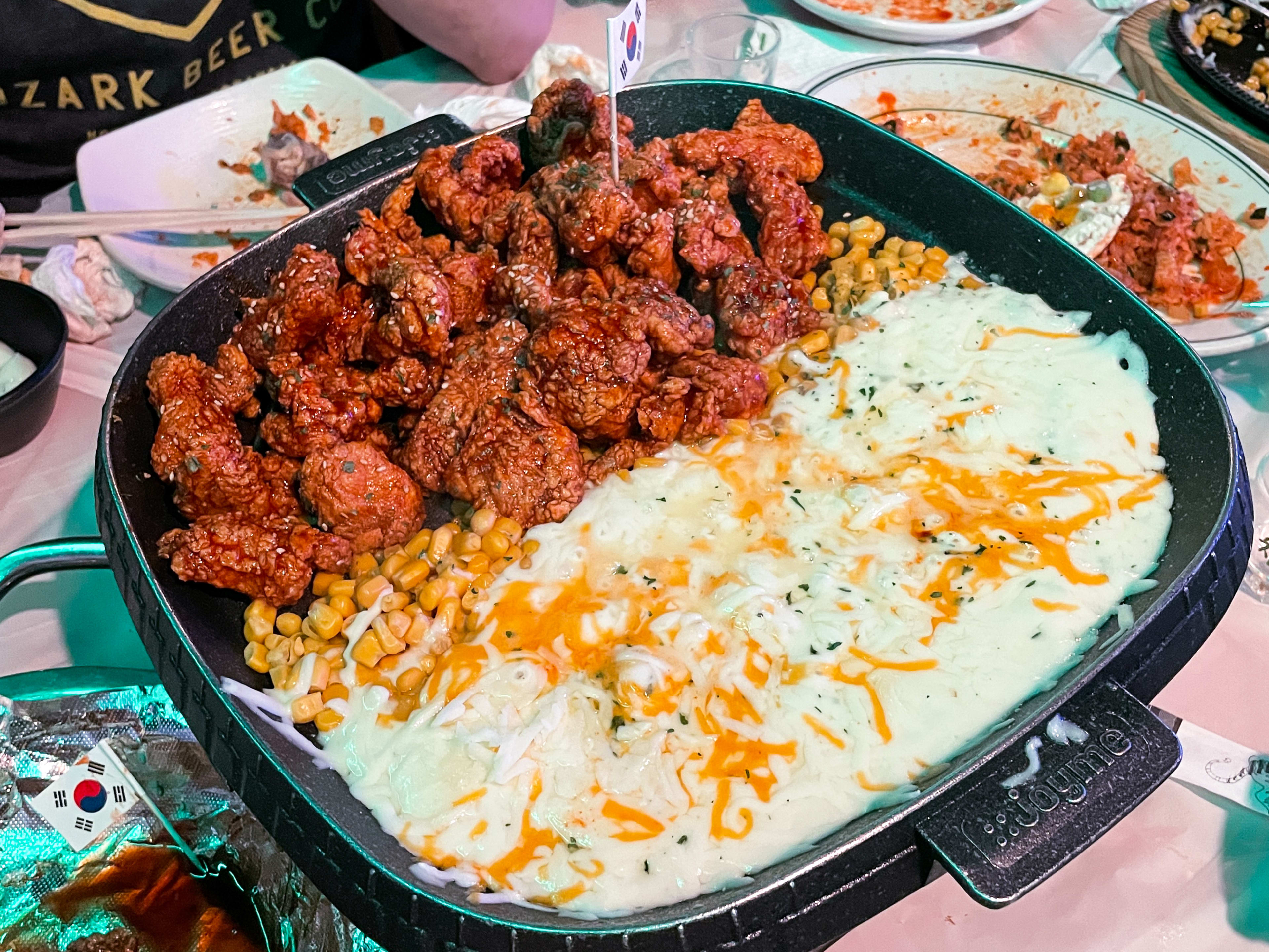 A table-top-griddle from Seoulju with fried chicken and melty cheese.